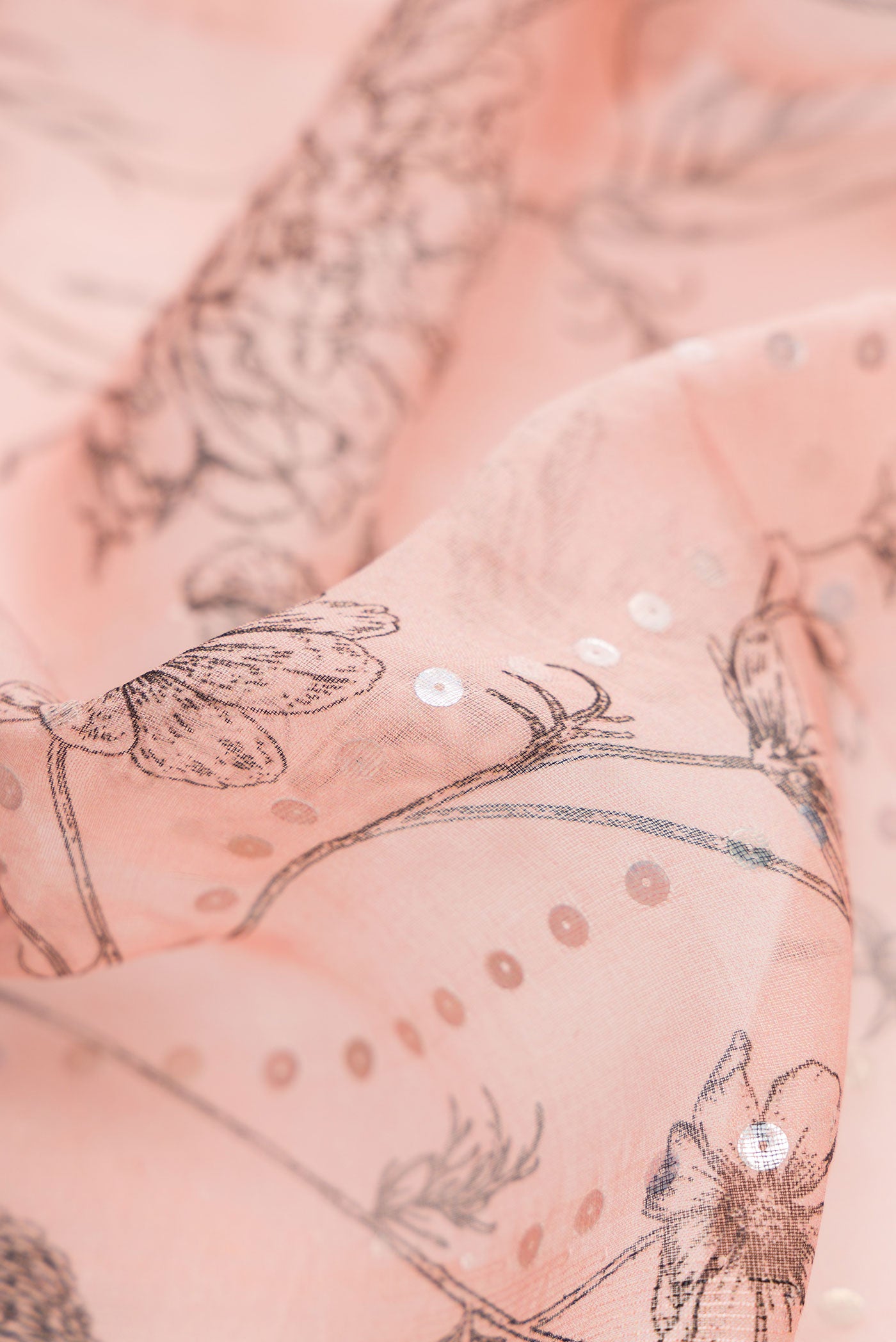 Close up of Rose pink Dual Tone Tussar Silk Saree with Embroidery on the body and Without Border displaying folds