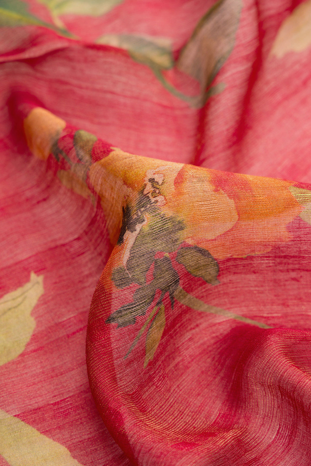 Close up of Dark Pink Dual Tone Tussar Silk Saree with Printed design on the body and Embroidery Border.  displaying folds