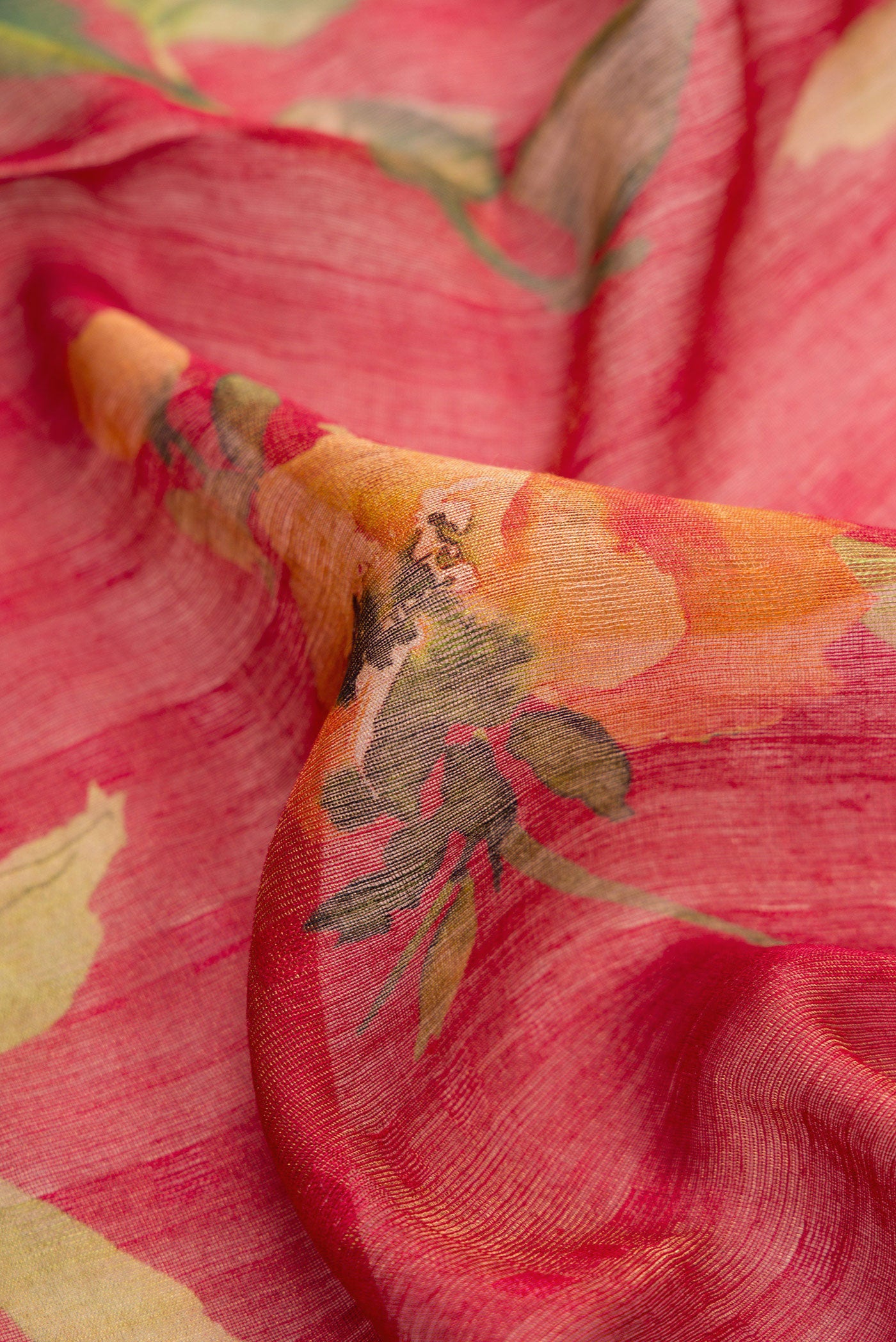 Close up of Dark Pink Dual Tone Tussar Silk Saree with Printed design on the body and Embroidery Border.  displaying folds