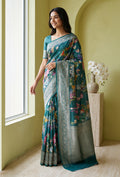 Model wearing a Blue Tussar Silk Saree with Floral Print on the body and Zari Border.