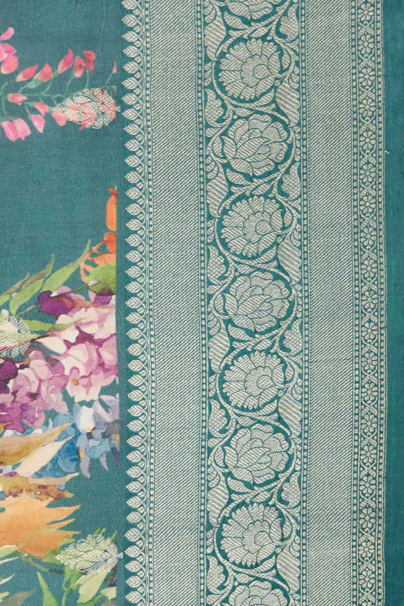 Border image of Blue Tussar Silk Saree with Floral Print on the body and Zari Border