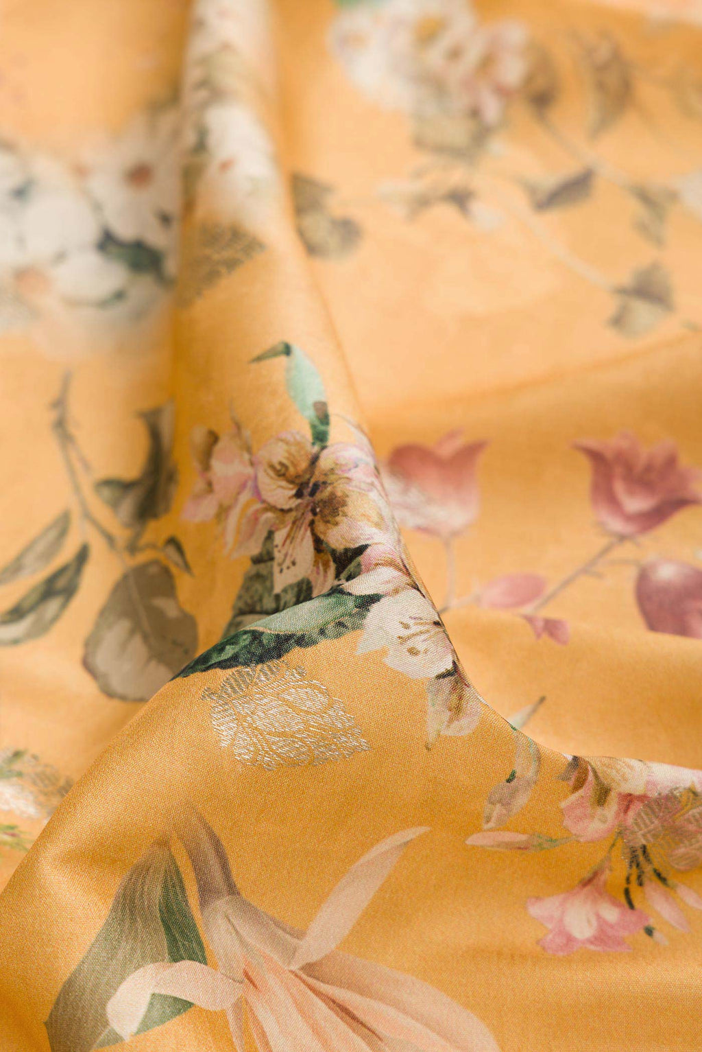 Close up of Sandal Dual Tone Tussar Silk Saree with Printed design on the body and Zari Border displaying folds