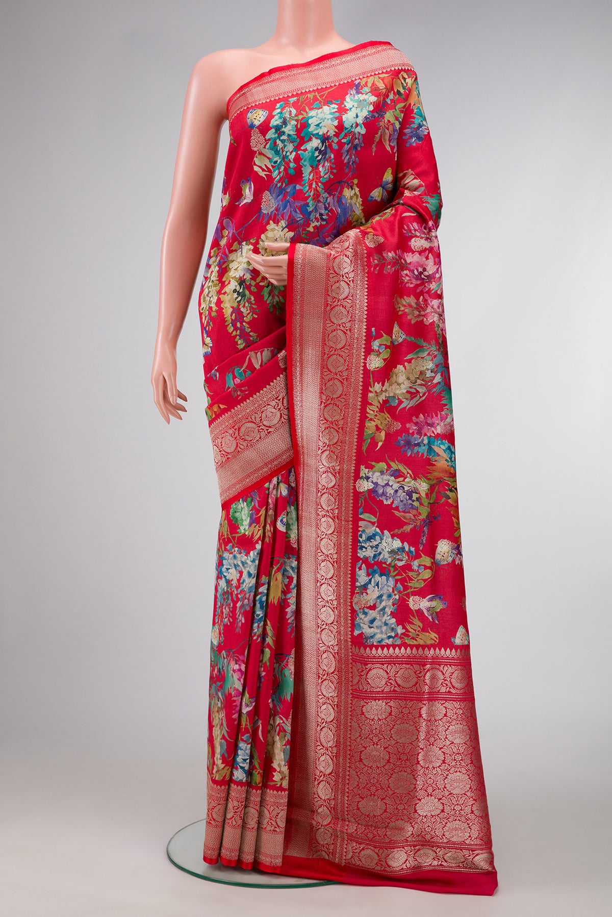 Red Dual Tone Tussar Saree with Printed design on the body and Zari Border.  displayed on a mannequin