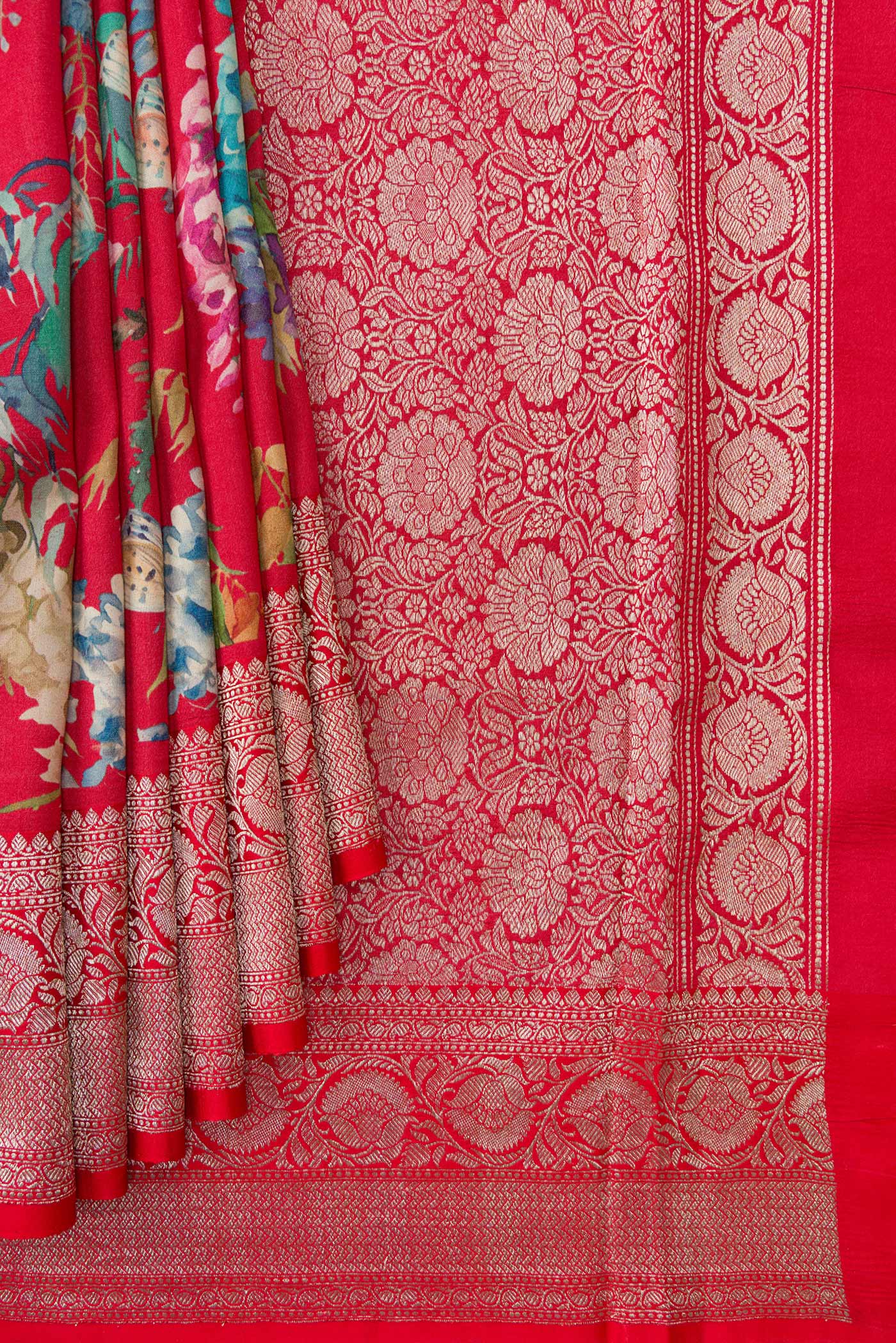 Pleats and pallu of Red Dual Tone Tussar Saree with Printed design on the body and Zari Border. 