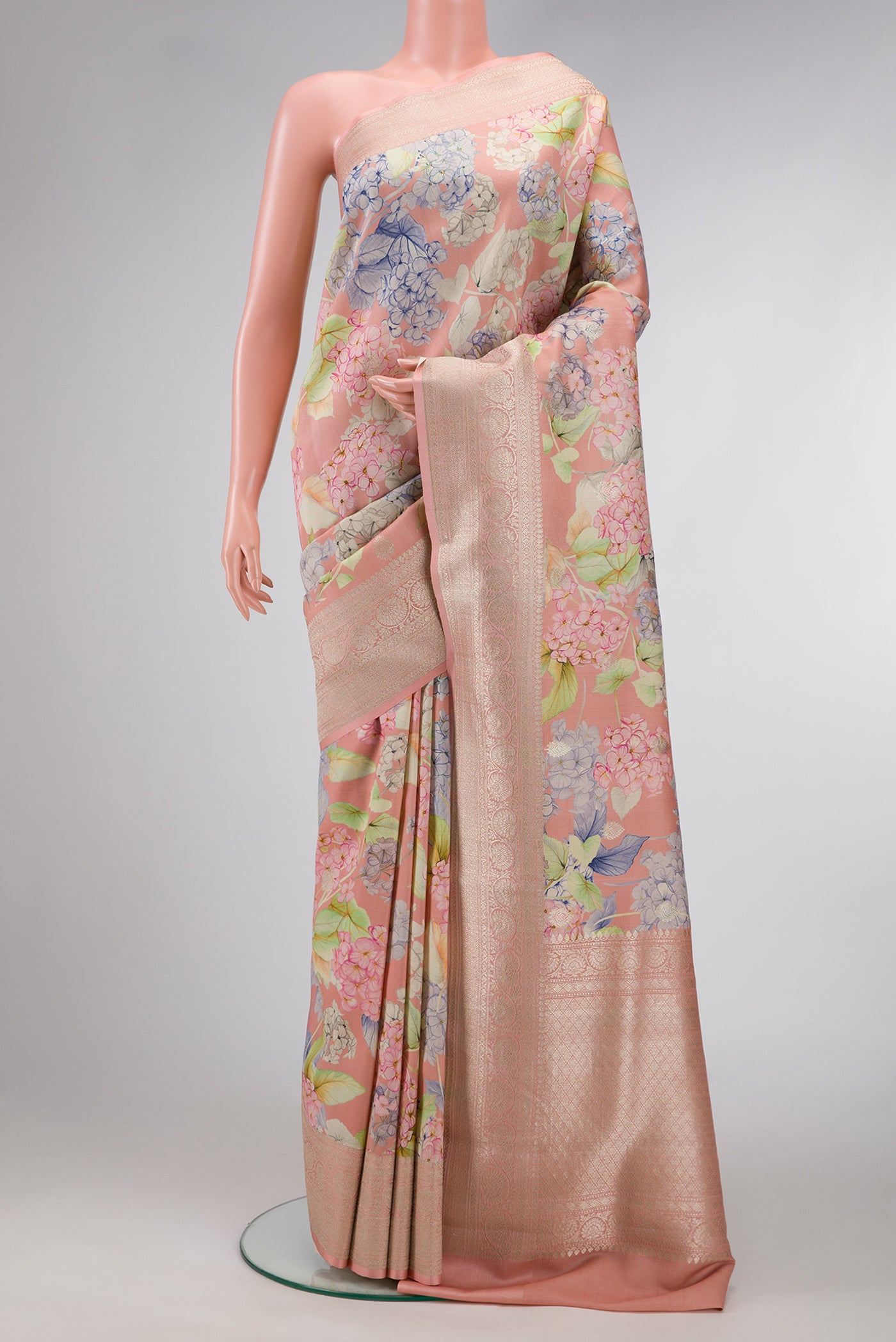 Rose Gold Dual Tone Tussar Silk Saree with Printed design on the body and Zari Border.  displayed on a mannequin