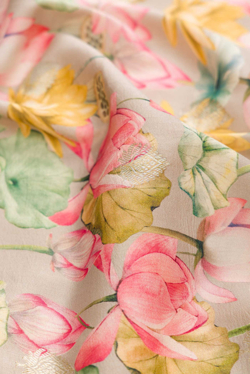 Close up of Dark Beige Dual Tone Tussar Silk Saree with Printed design on the body and Zari Border displaying folds