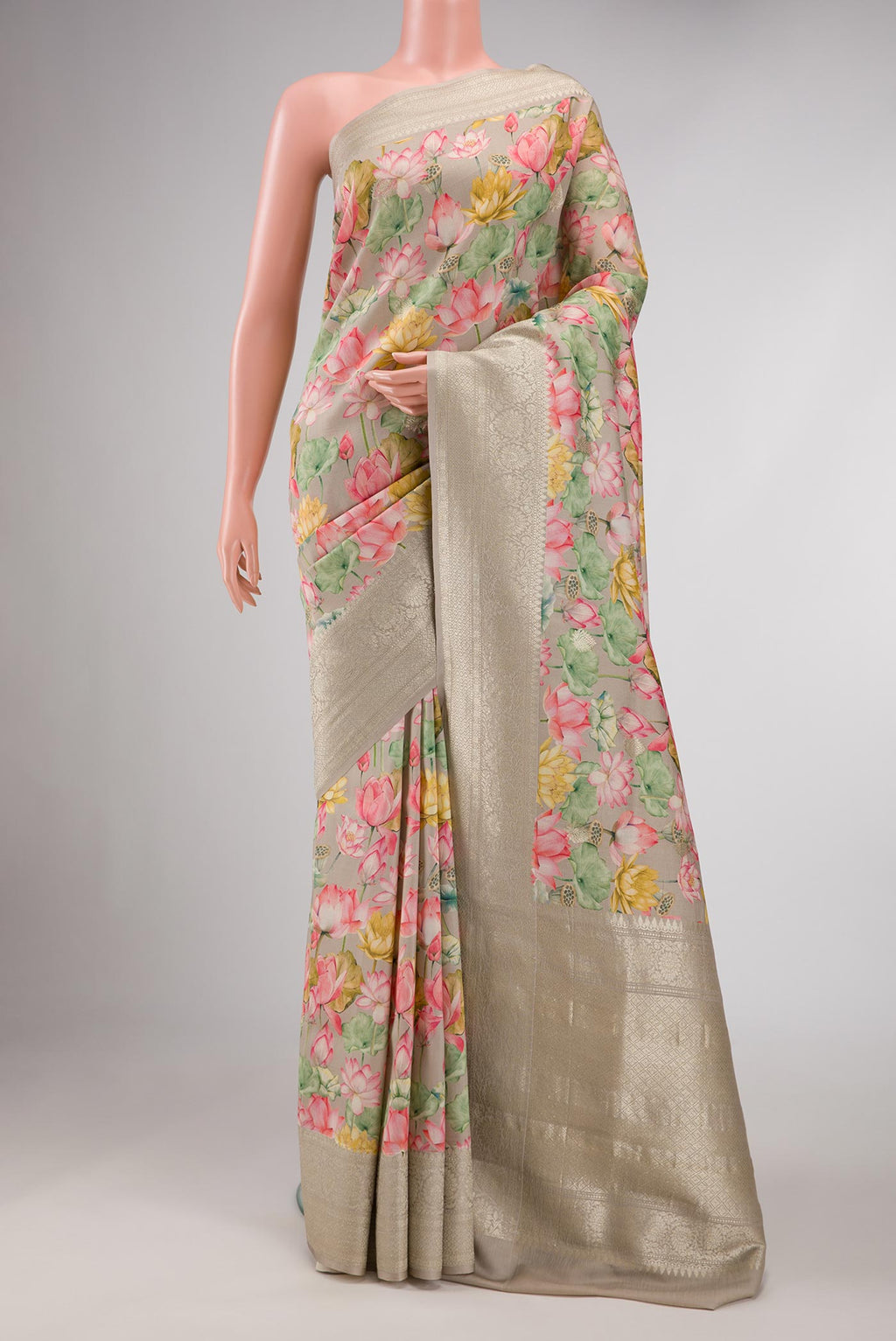 Dark Beige Dual Tone Tussar Silk Saree with Printed design on the body and Zari Border displayed on a mannequin