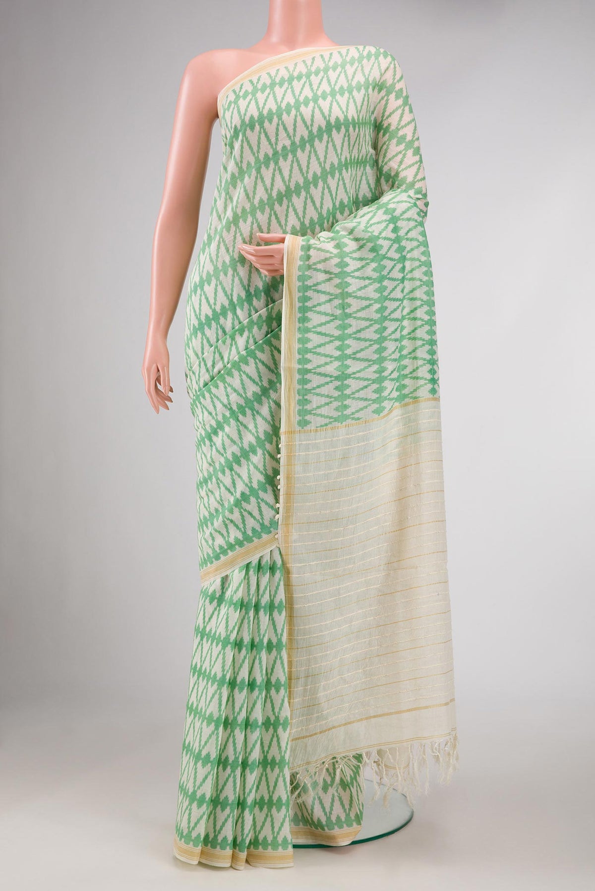 Green Dual Tone Tussar Silk Saree with Printed design on the body and Thread Border displayed on a mannequin