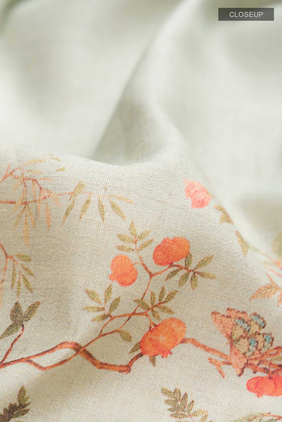 Close up of Light Green Bhagalpuri Tussar Silk SareePrinted design on the body and Zari Border displaying folds