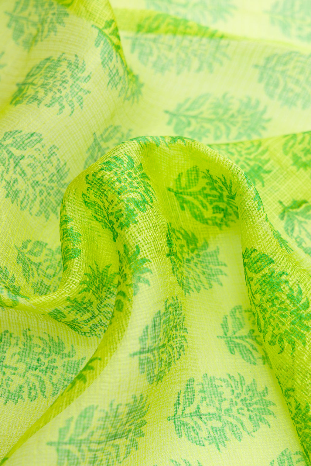 Close up of Parrot Green Dual Tone Kota Silk Saree with Printed design on the body and Zari Border.  displaying folds
