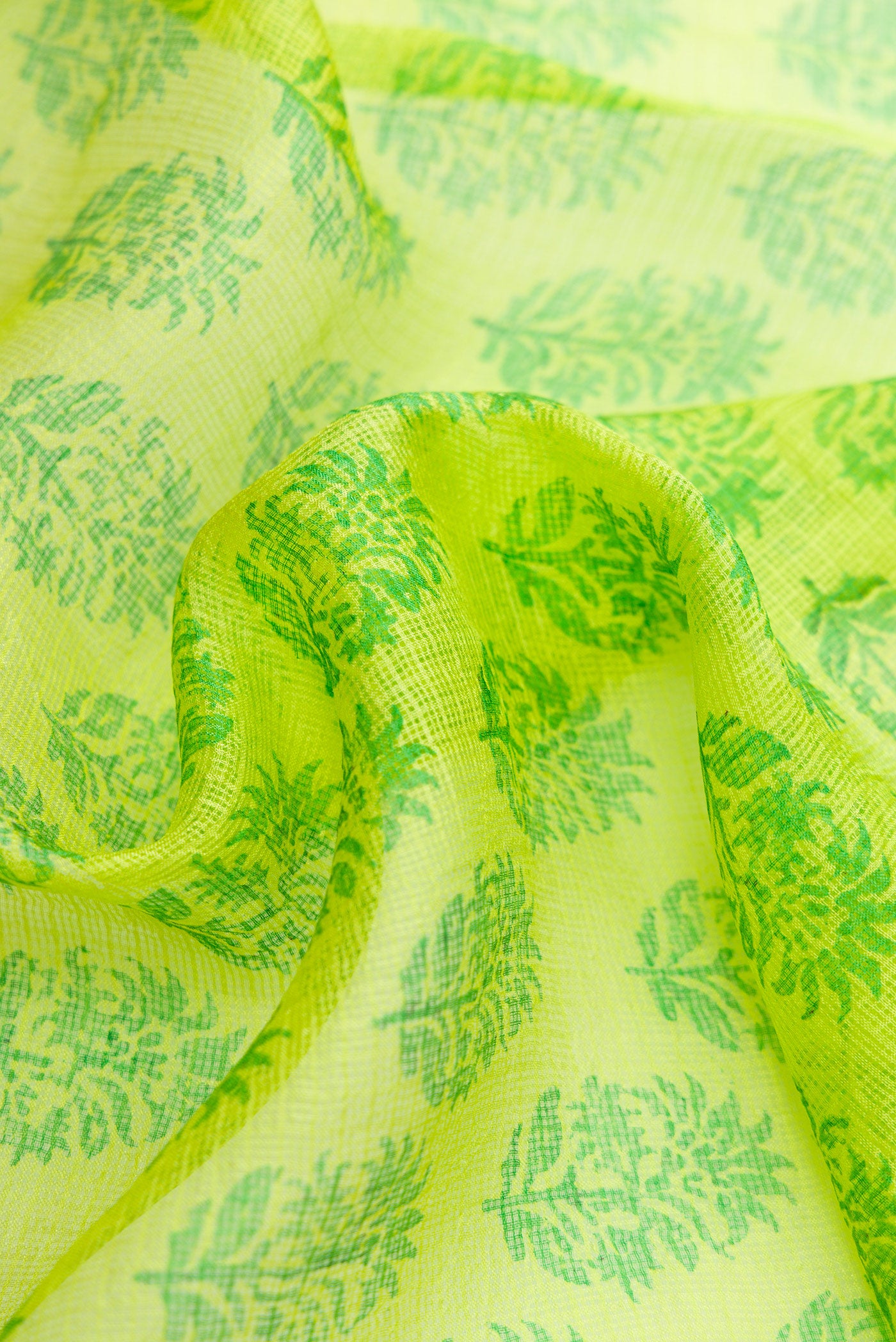 Close up of Parrot Green Dual Tone Kota Silk Saree with Printed design on the body and Zari Border.  displaying folds