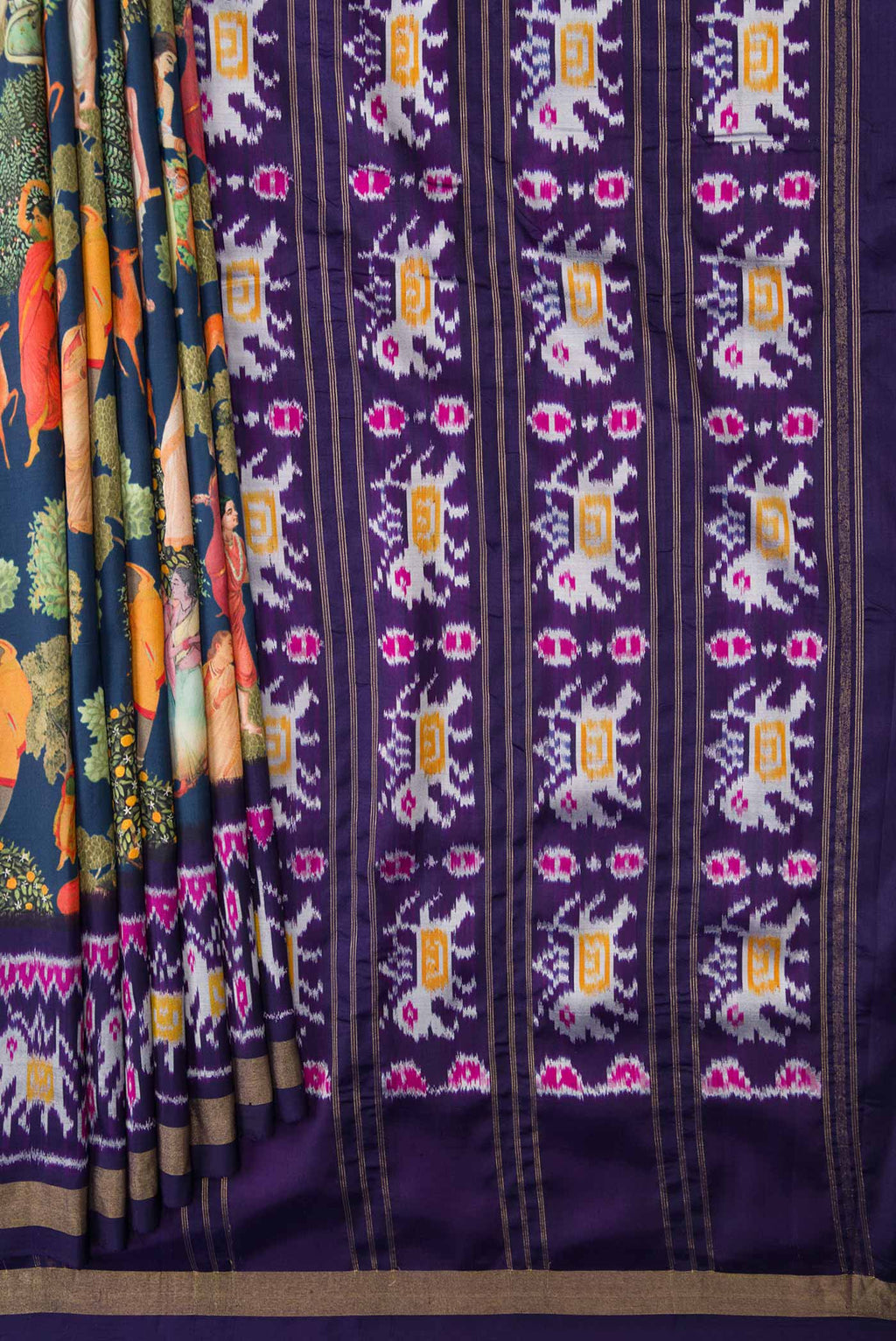 Pleats and pallu of Navy Blue Dual Tone Kanchipuram Silk Saree with Printed design on the body and Ikat Border