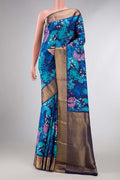 Blue Dual Tone Kanchipuram Silk SareePrinted design on the body and Zari Border displayed on a mannequin