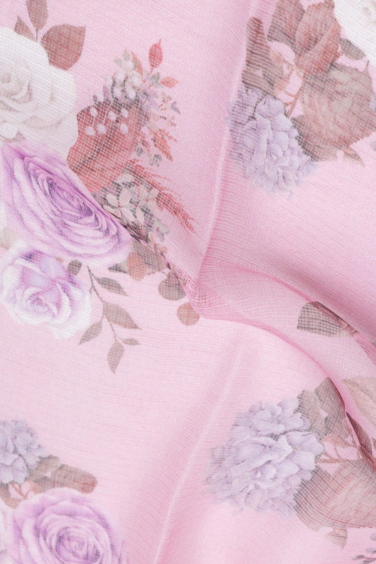 Close up of Pink Kota Silk Saree with Floral Print on the body and Zari Border.  displaying folds