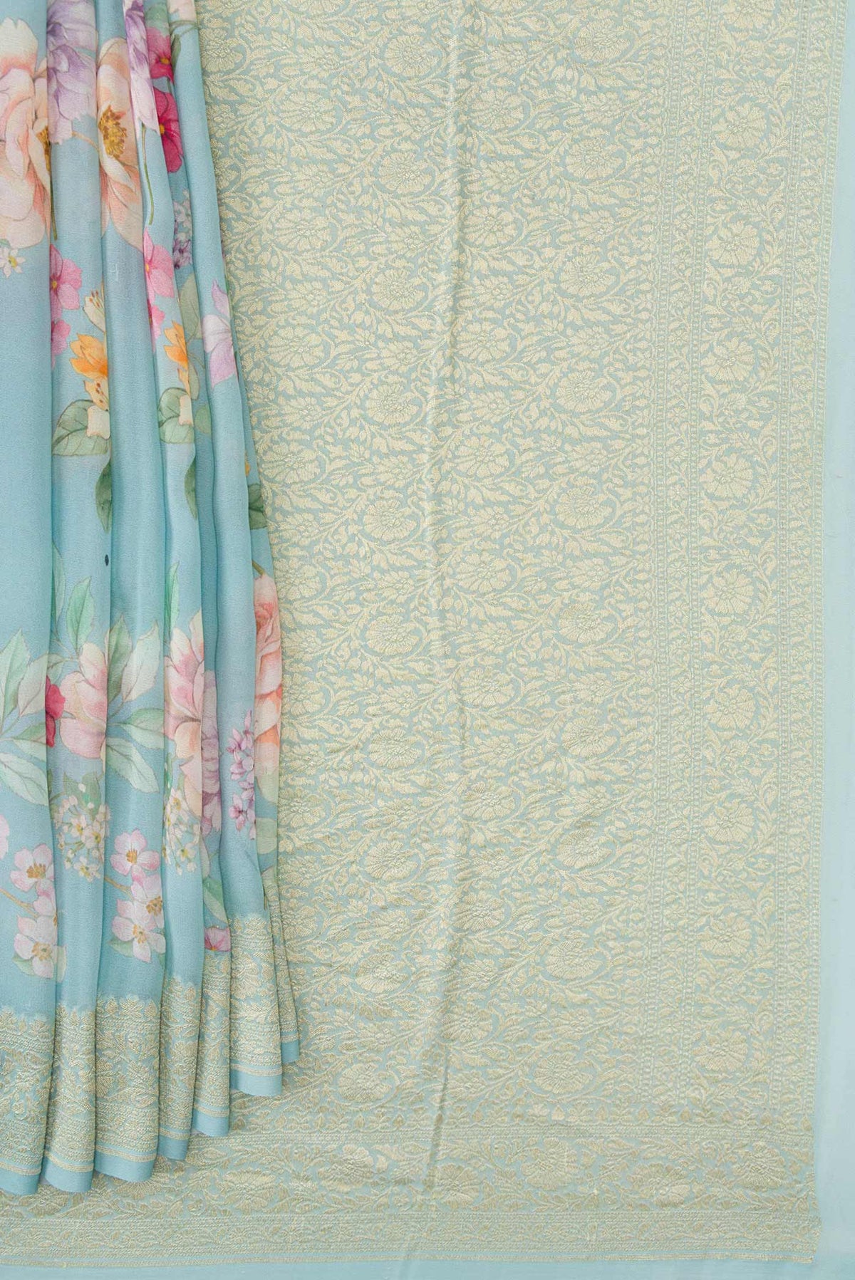 Pleats and pallu of Light Blue Dual Tone Mysore Georgette Saree with Printed design on the body and Zari Border