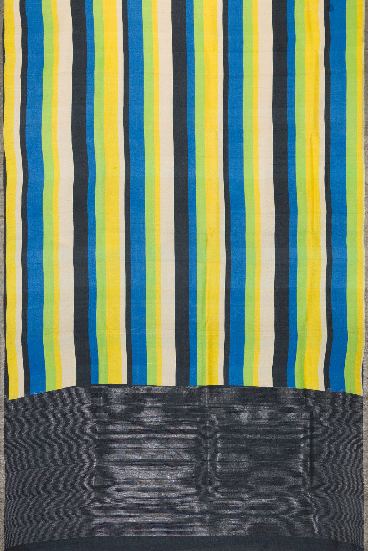 Flat view of Parrot Green,Blue and Black Color Tussar Silk Saree with Stripes on the body and Zari Border. 
