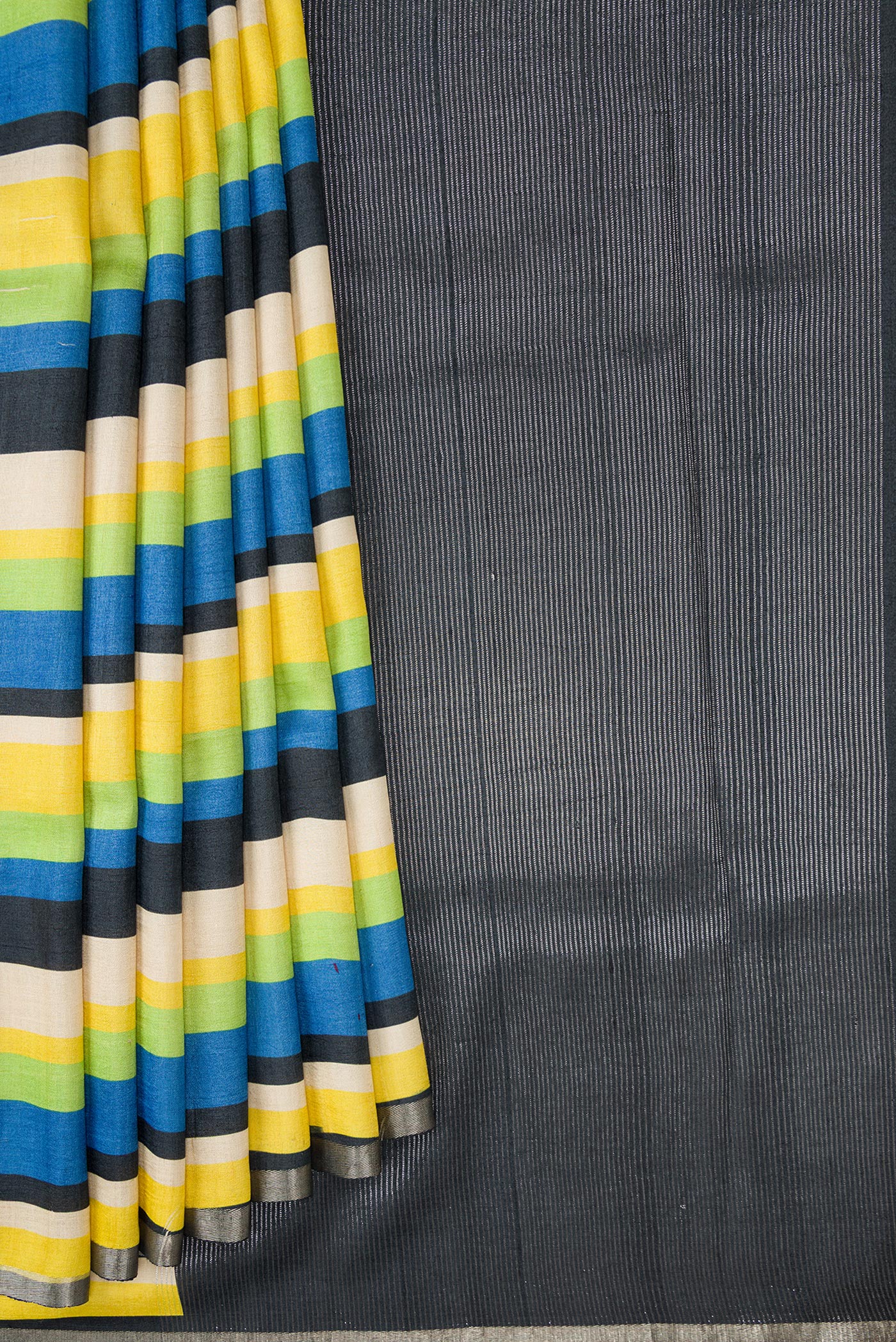 Pleats and pallu of Parrot Green,Blue and Black Color Tussar Silk Saree with Stripes on the body and Zari Border. 