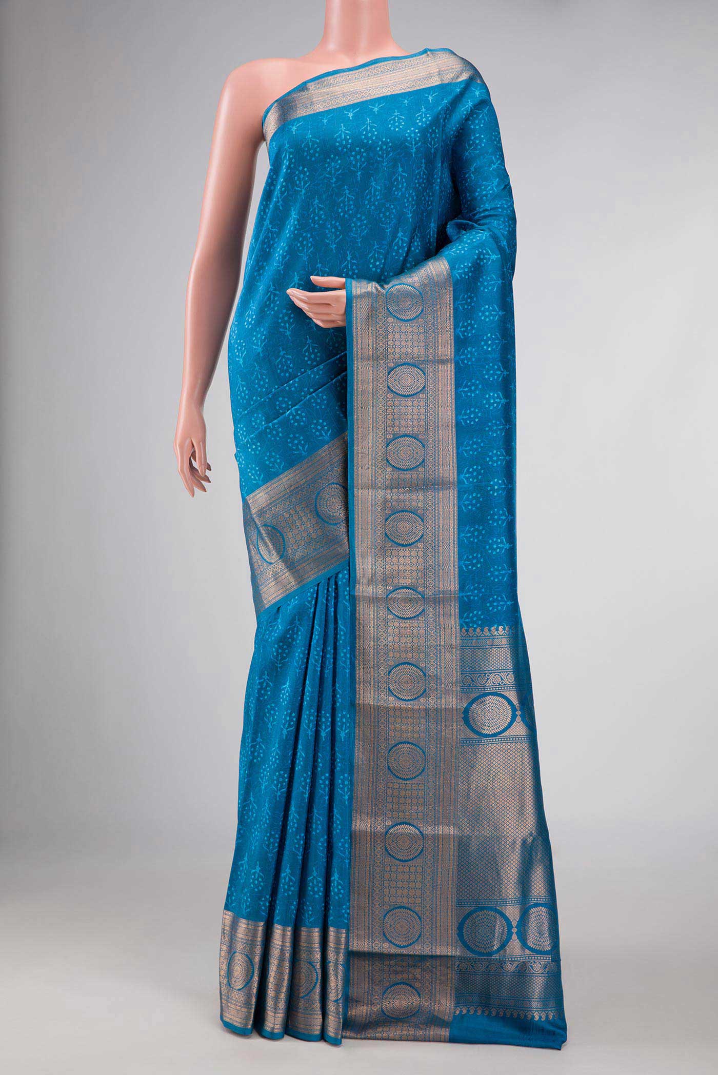 Blue Dual Tone Kanchipuram Silk Saree with Printed design on the body and Zari Border displayed on a mannequin