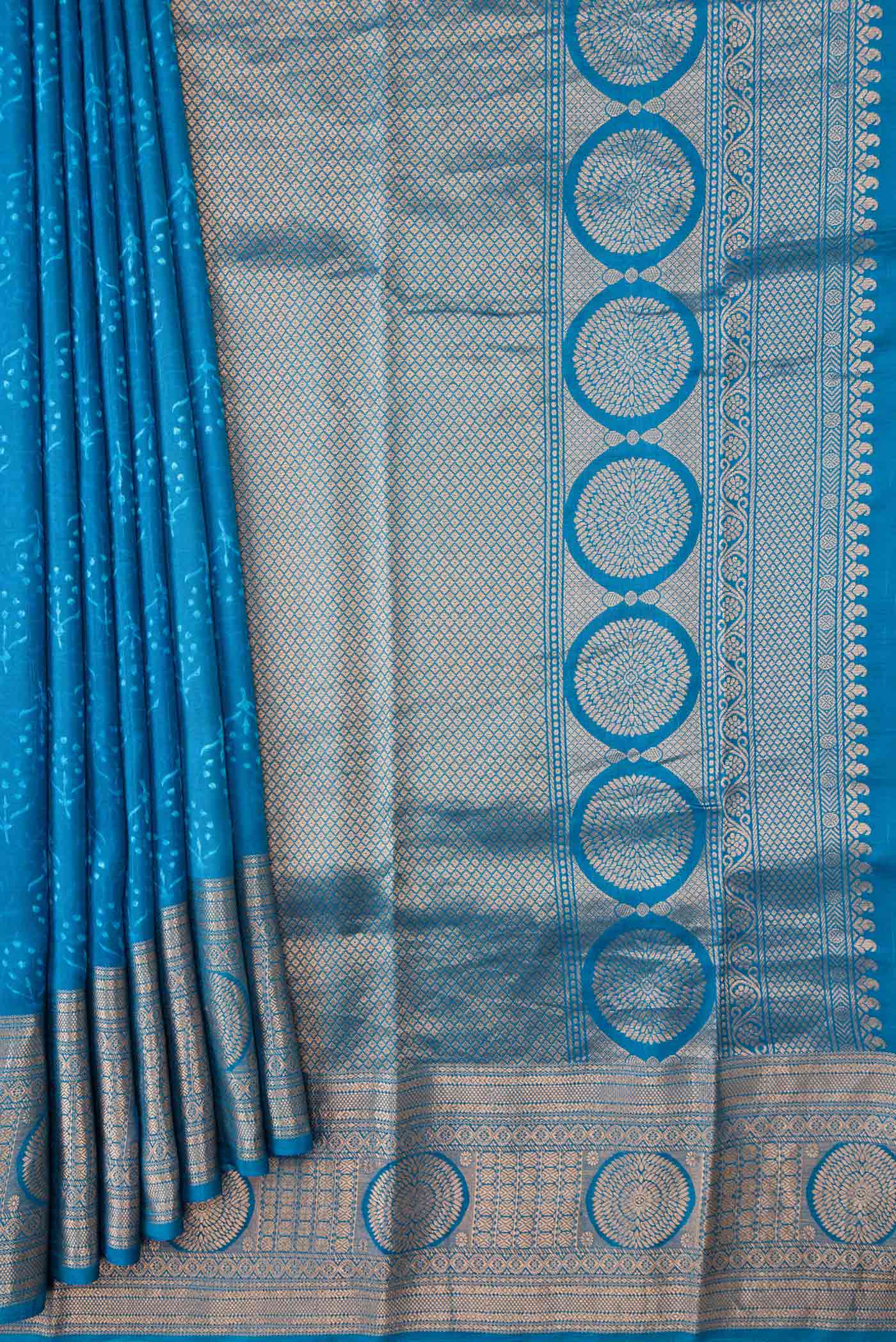 Pleats and pallu of Blue Dual Tone Kanchipuram Silk Saree with Printed design on the body and Zari Border