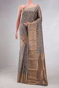 Grey Dual Tone Kanchipuram Silk Saree with Printed design on the body and Temple Border displayed on a mannequin