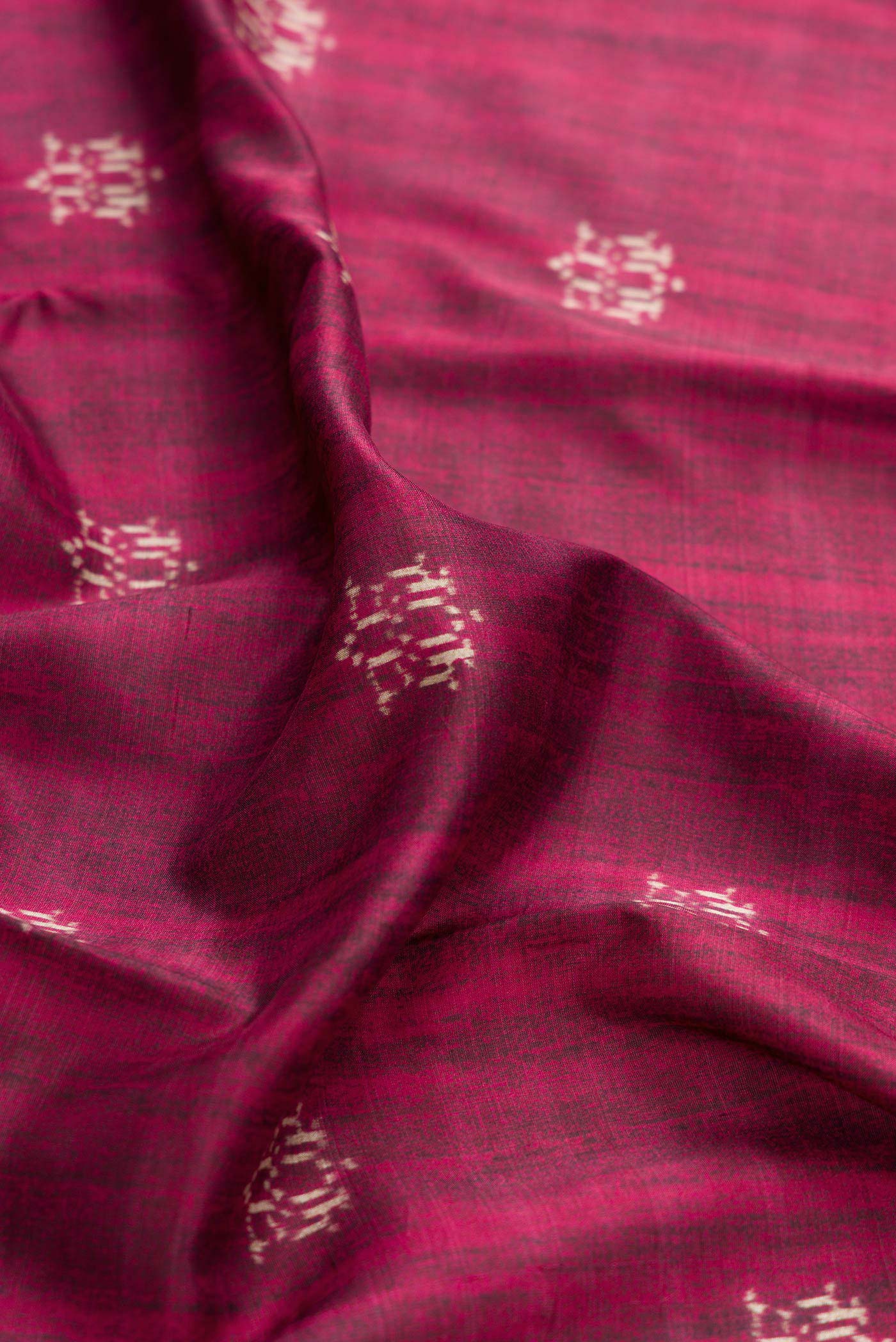 Close up of Purple Dual Tone Kanchipuram Silk Saree with Printed design on the body and Thread Border displaying folds