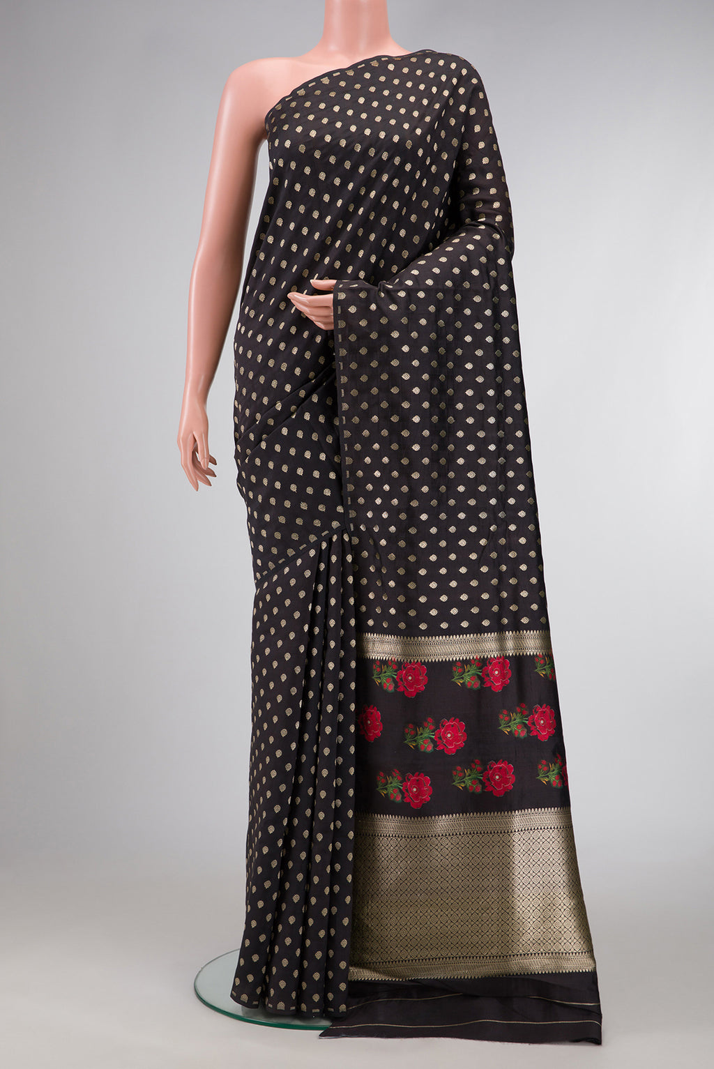 Black Dual Tone Tussar Silk Saree with Zari Butta on the body and Without Border.  displayed on a mannequin