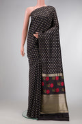 Black Dual Tone Tussar Silk Saree with Zari Butta on the body and Without Border.  displayed on a mannequin