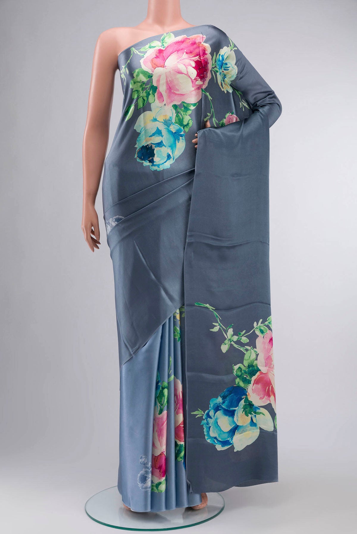 Blue Satin Crepe Saree Printed design on the body and Without Border displayed on a mannequin