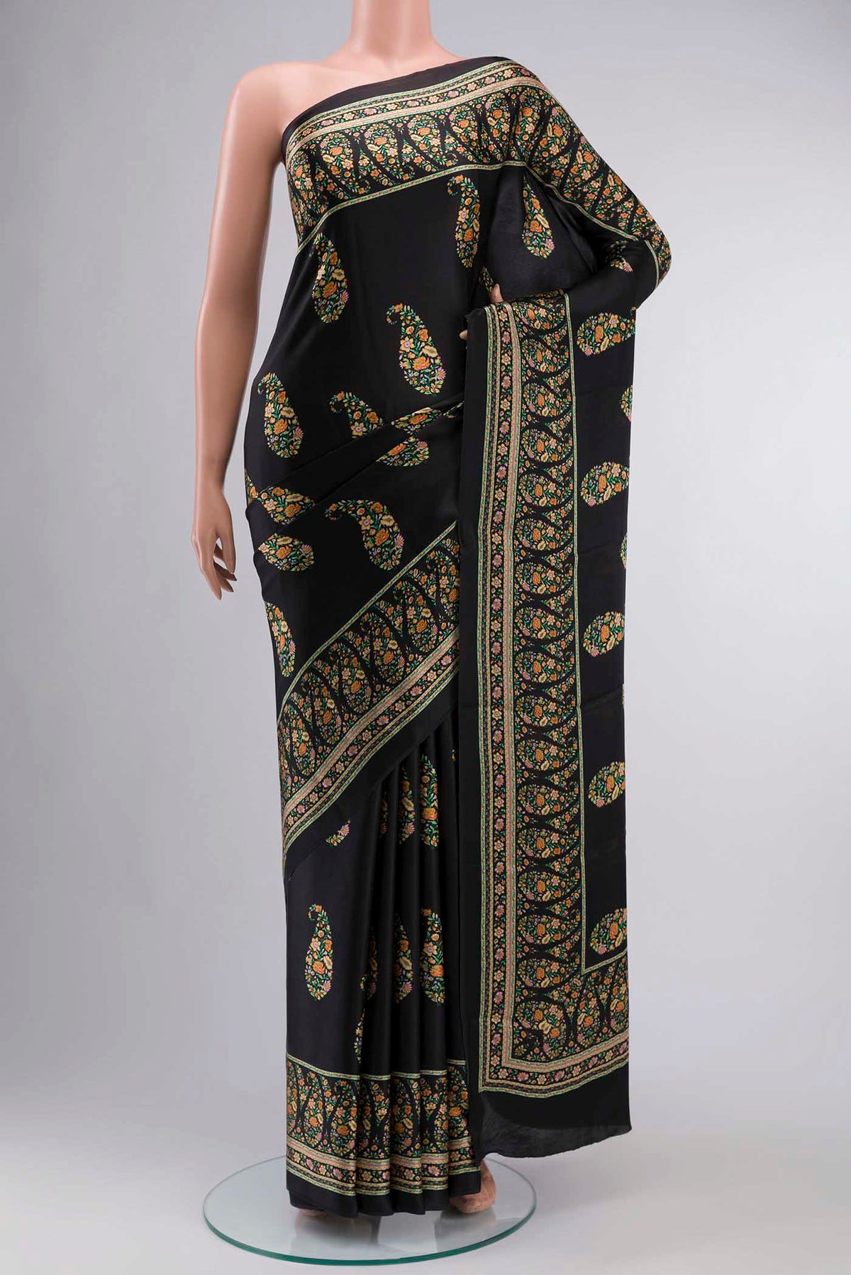 Black Satin Crepe Saree Printed design on the body and Plain Border displayed on a mannequin