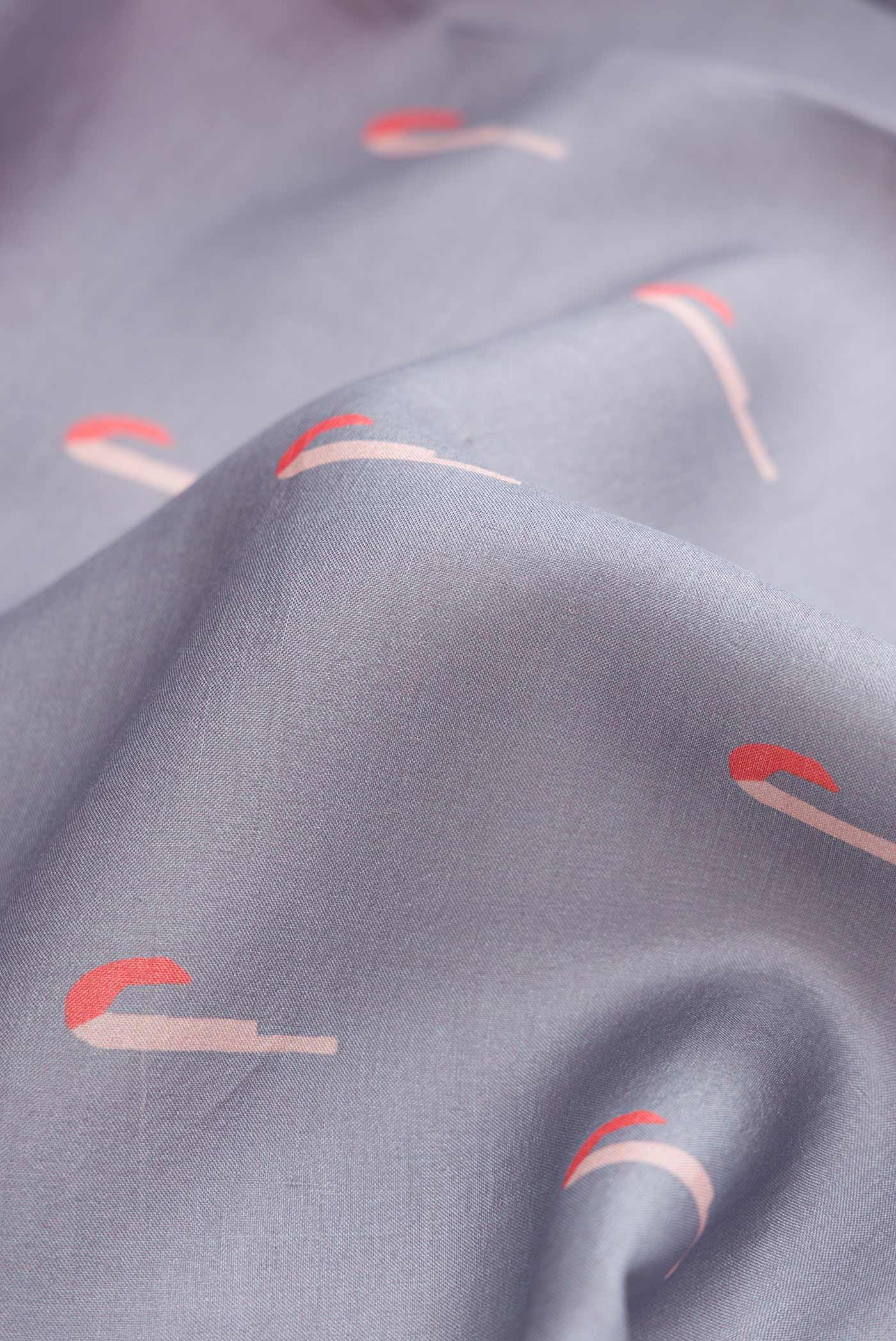 Close up of Grey Dual Tone Tussar Silk Saree with Thread Butta on the body and Thread Border displaying folds