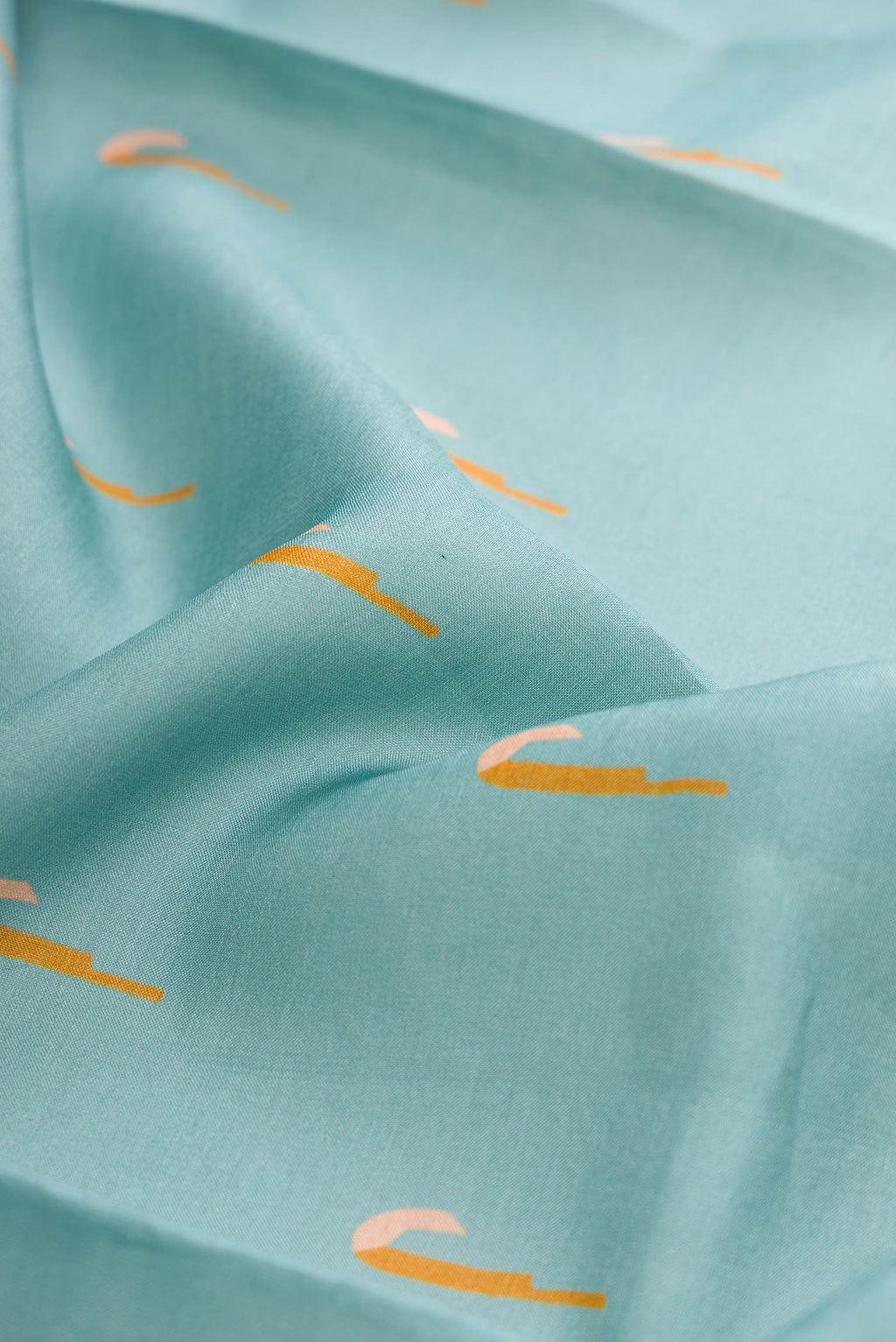 Close up of Grey Dual Tone Tussar Silk Saree with Thread Butta on the body and Thread Border displaying folds