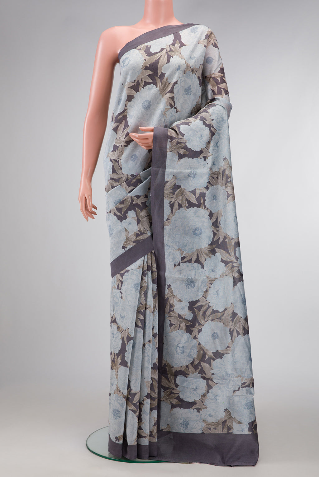 Grey Dual Tone Tussar Silk Saree with Printed design on the body and Plain Border.  displayed on a mannequin