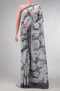 Grey Dual Tone Tussar Silk Saree with Printed design on the body and Plain Border.  displayed on a mannequin