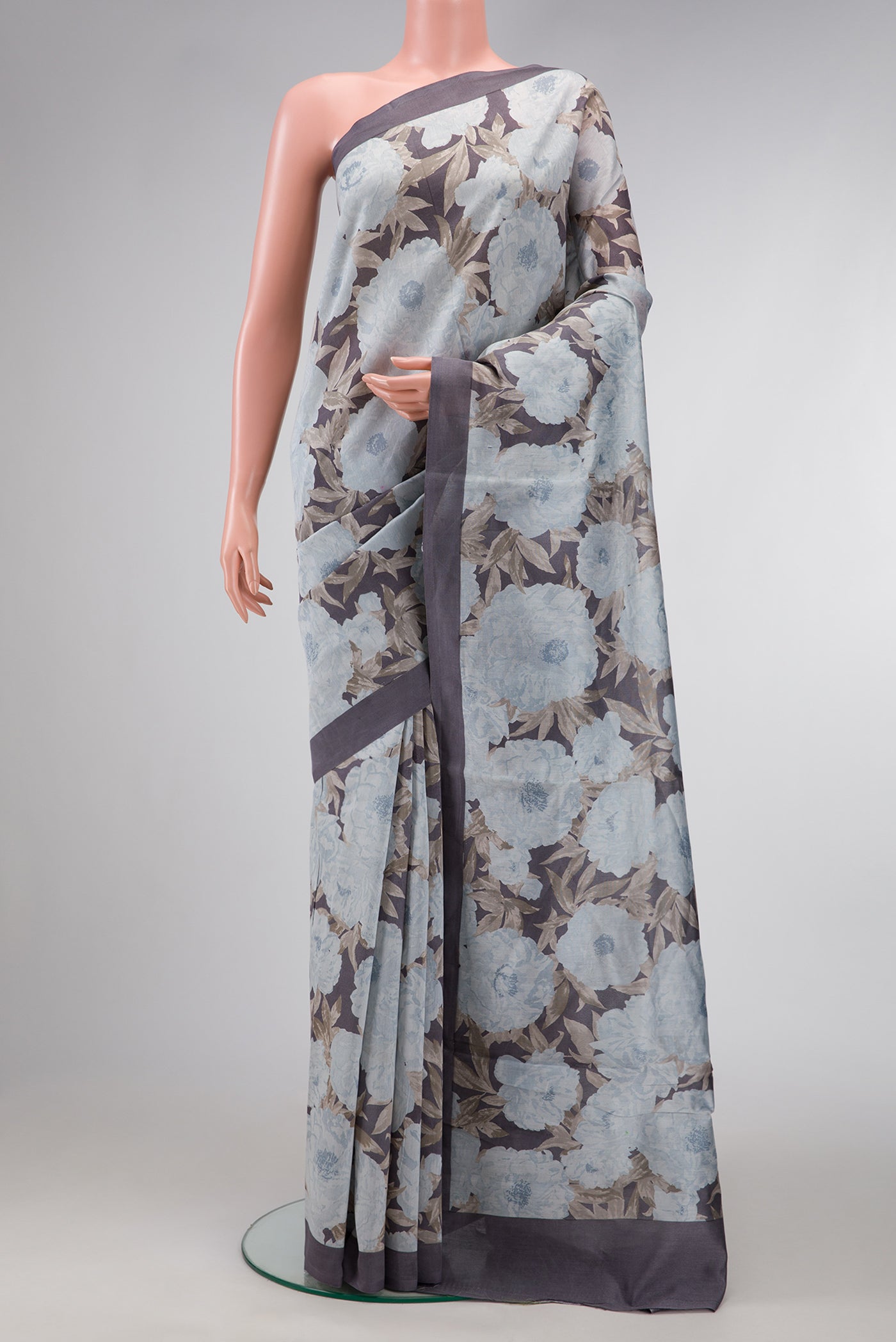 Grey Dual Tone Tussar Silk Saree with Printed design on the body and Plain Border.  displayed on a mannequin