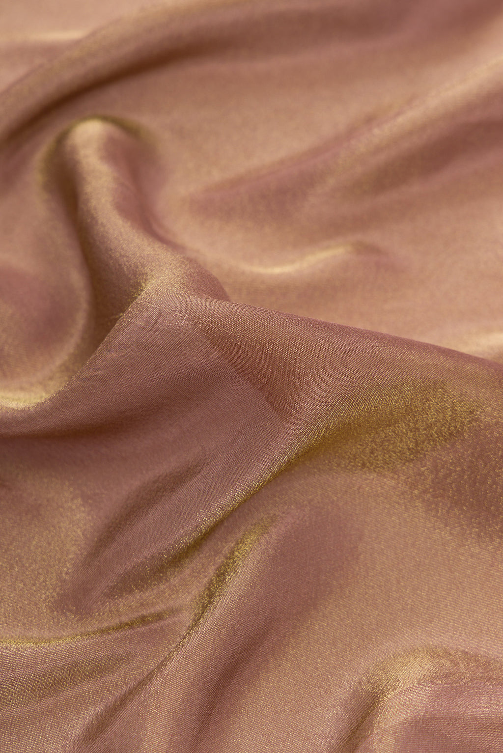 Close up of Brown Dual Tone Mysore Georgette Saree with Plain Body and Fancy Border.  displaying folds