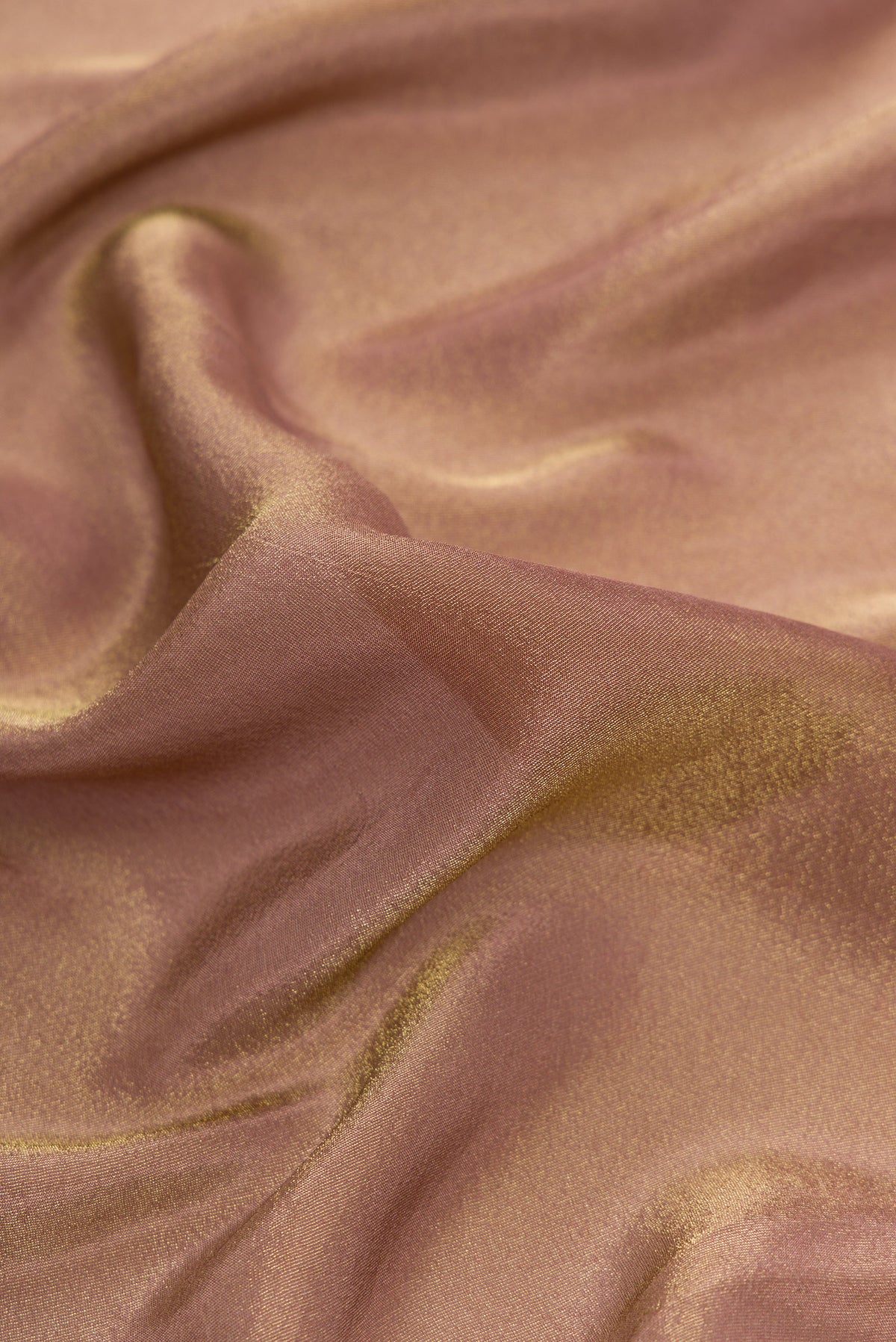 Close up of Brown Dual Tone Mysore Georgette Saree with Plain Body and Fancy Border.  displaying folds