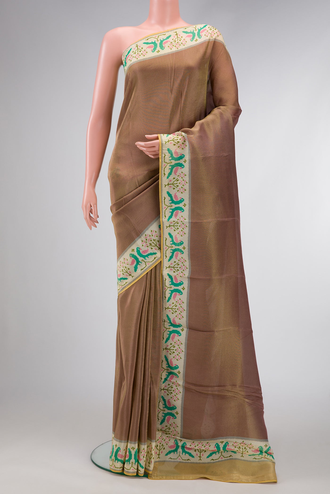 Brown Dual Tone Mysore Georgette Saree with Plain Body and Fancy Border.  displayed on a mannequin
