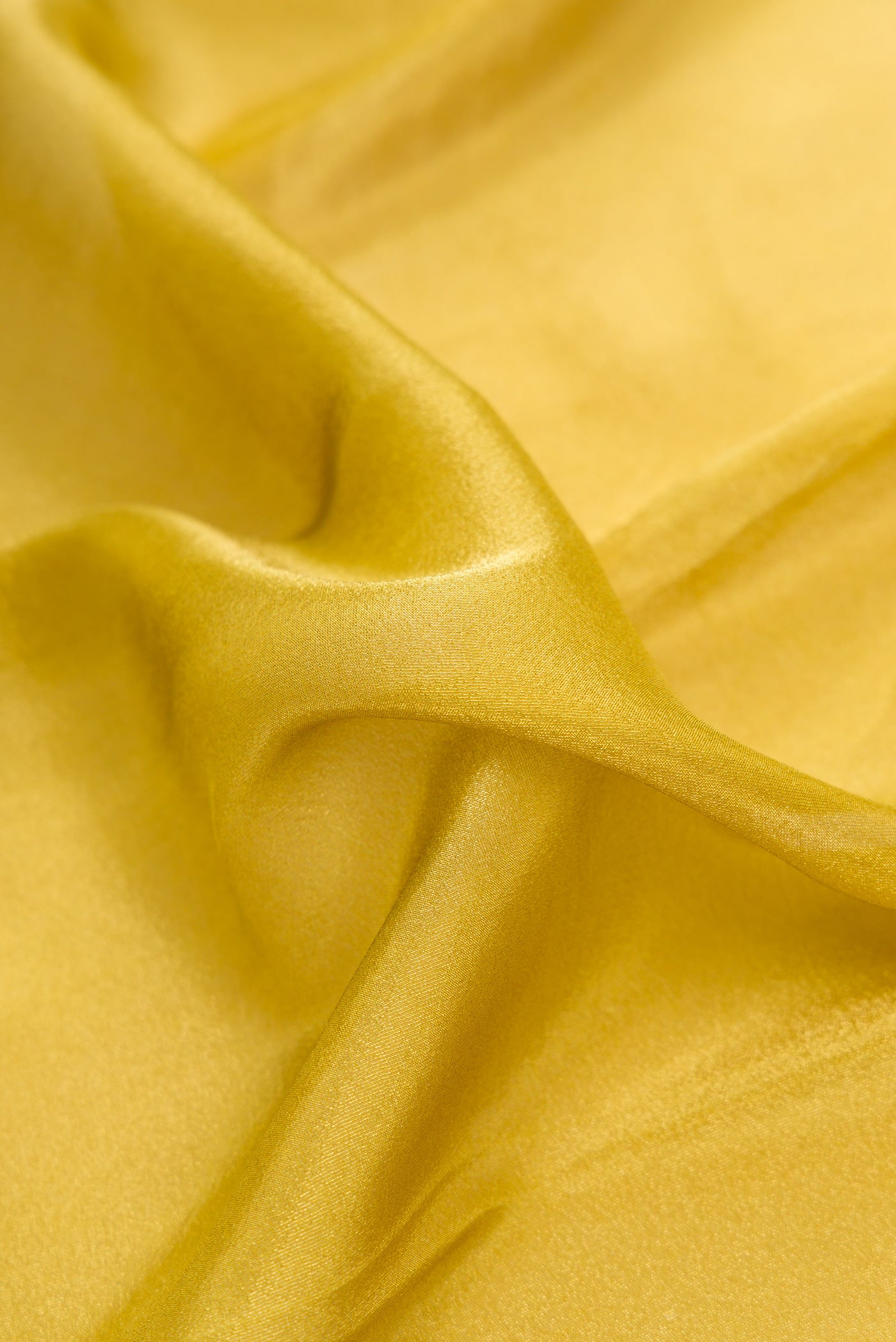 Close up of Parrot Green Dual Tone Mysore Georgette Saree with Plain Body and Fancy Border.  displaying folds