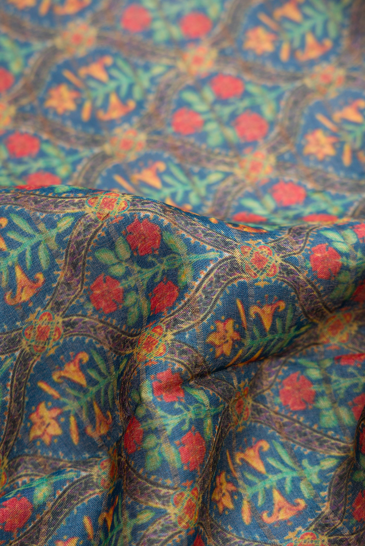 Close up of Green Dual Tone Tussar Silk Saree with Printed design on the body and Zari Border.  displaying folds