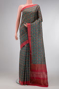 Green Dual Tone Tussar Silk Saree with Printed design on the body and Zari Border.  displayed on a mannequin