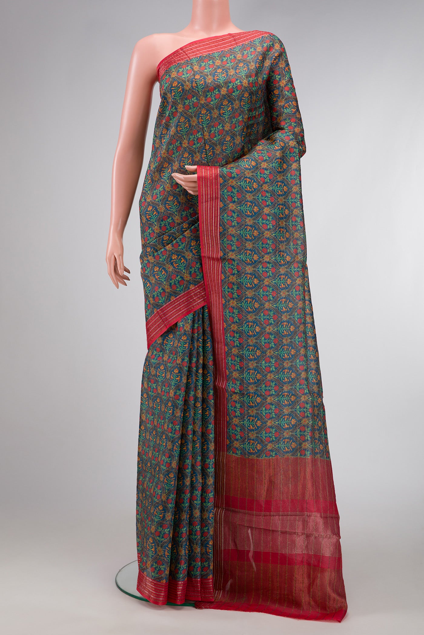 Green Dual Tone Tussar Silk Saree with Printed design on the body and Zari Border.  displayed on a mannequin