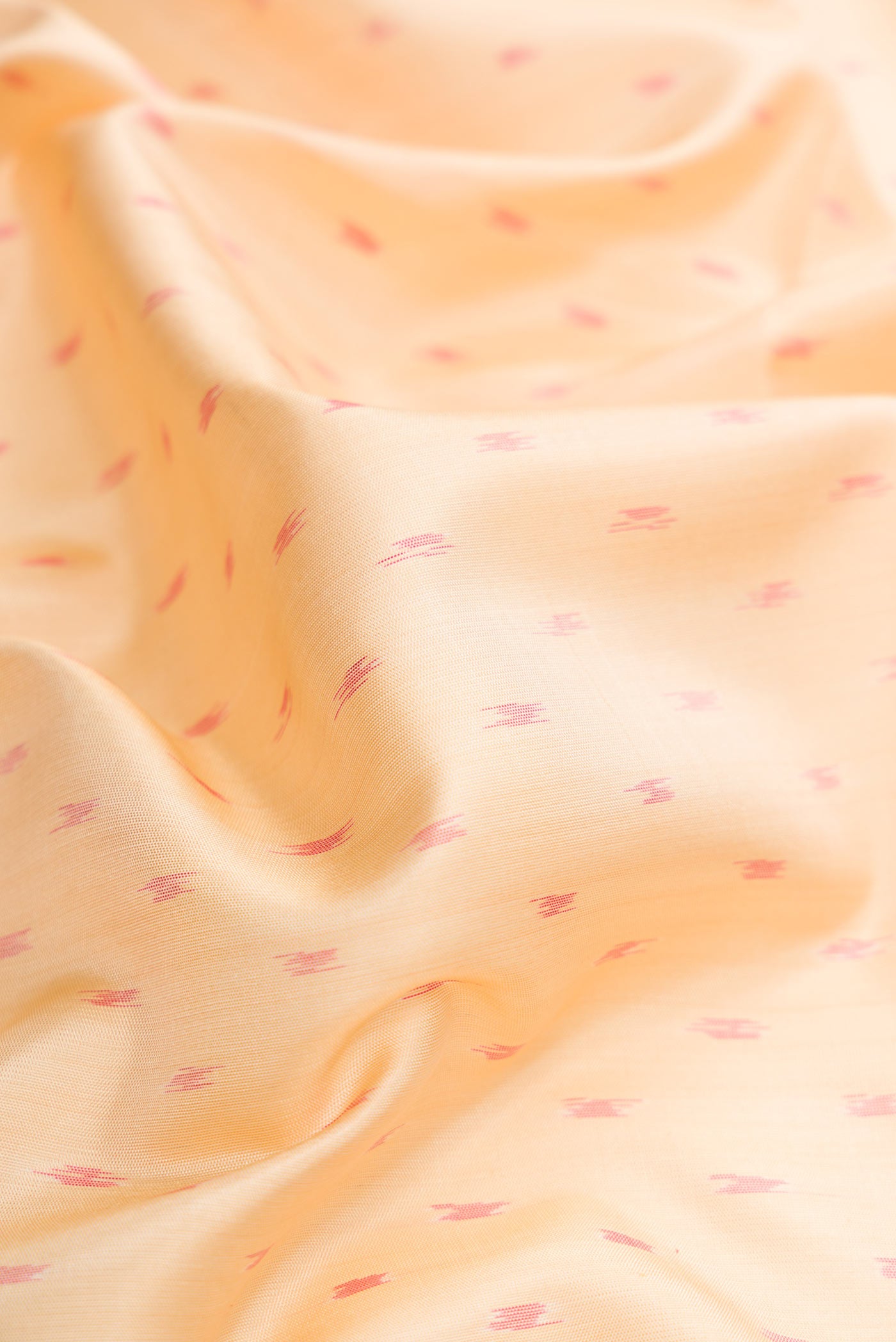 Close up of Sandal Dual Tone Soft Silk Saree with Ikat Print on the body and Ikat Border.  displaying folds