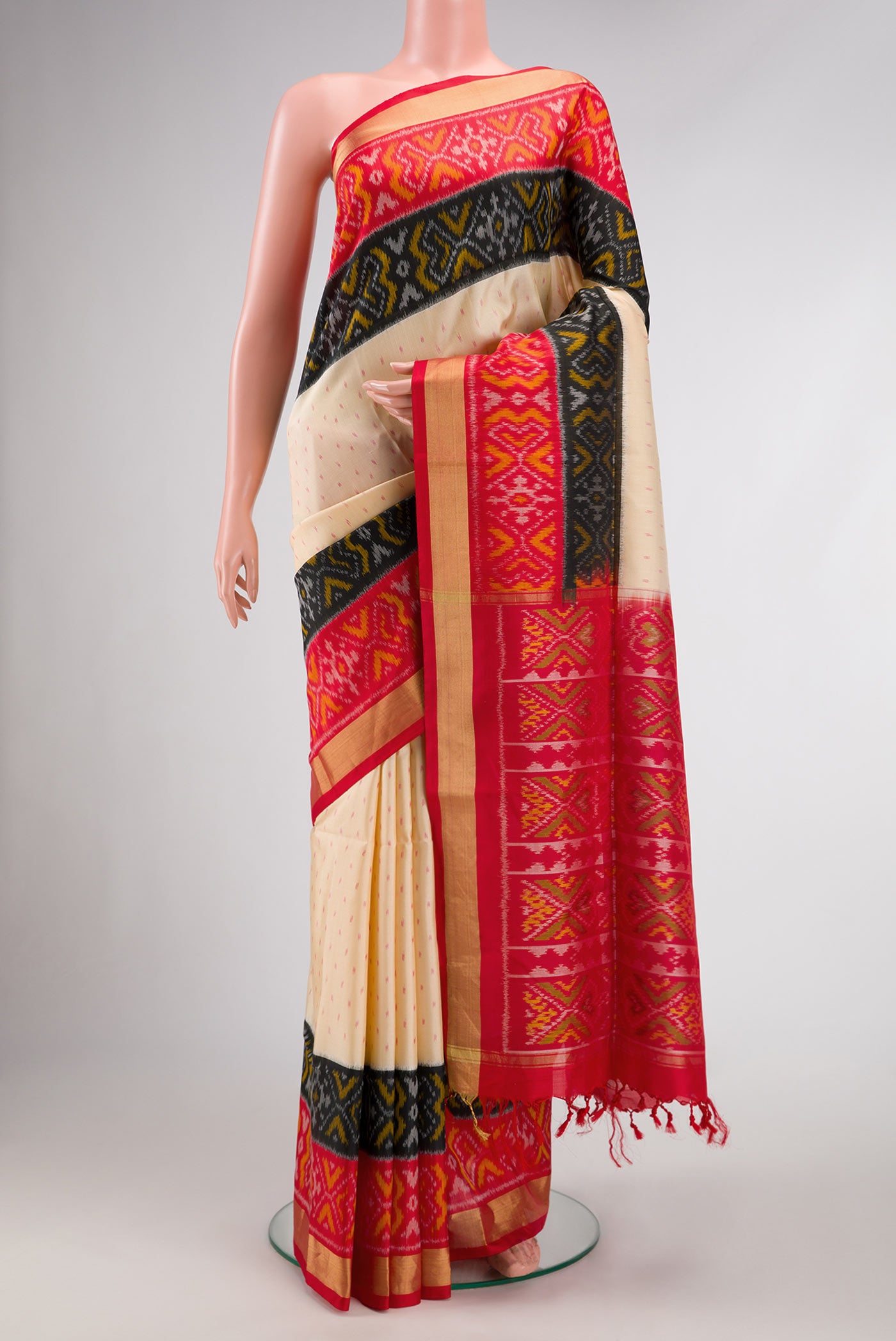 Sandal Dual Tone Soft Silk Saree with Ikat Print on the body and Ikat Border.  displayed on a mannequin