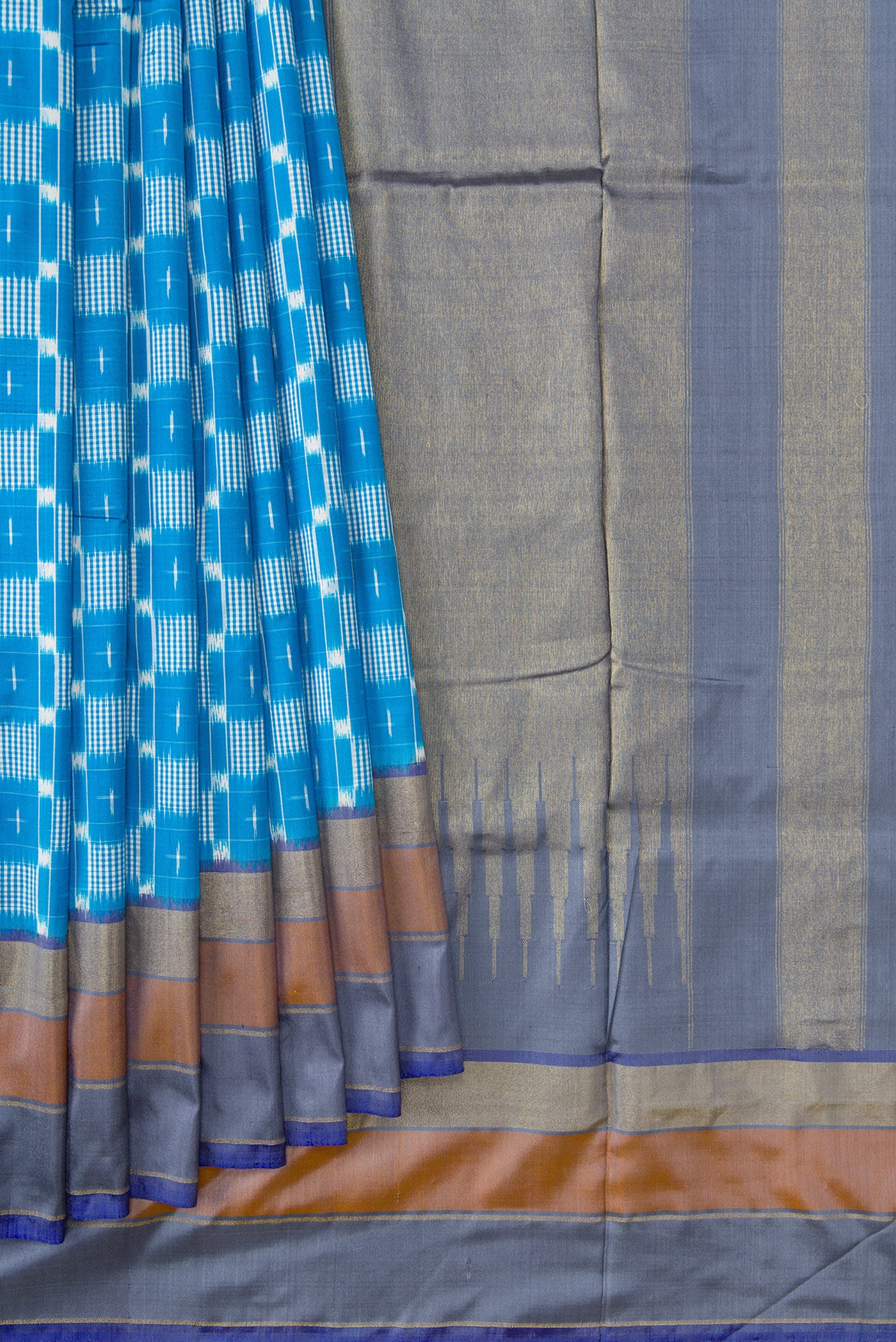 Pleats and pallu of Sky Blue Dual Tone Double Ikat Saree with Ikat Print on the body and Zari Border. 