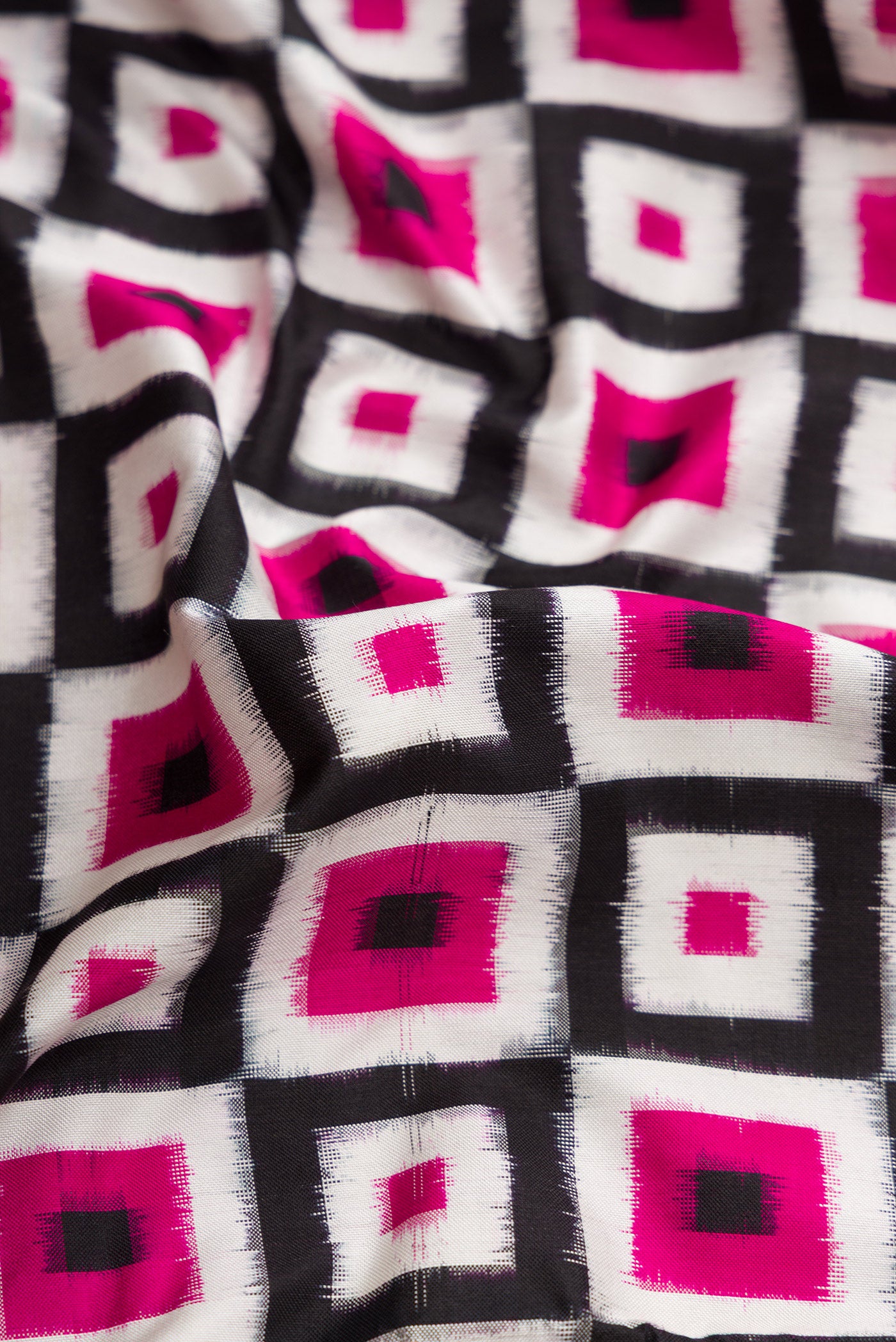 Close up of Off White Dual Tone Double Ikat Saree with Ikat Print on the body and Zari Border.  displaying folds