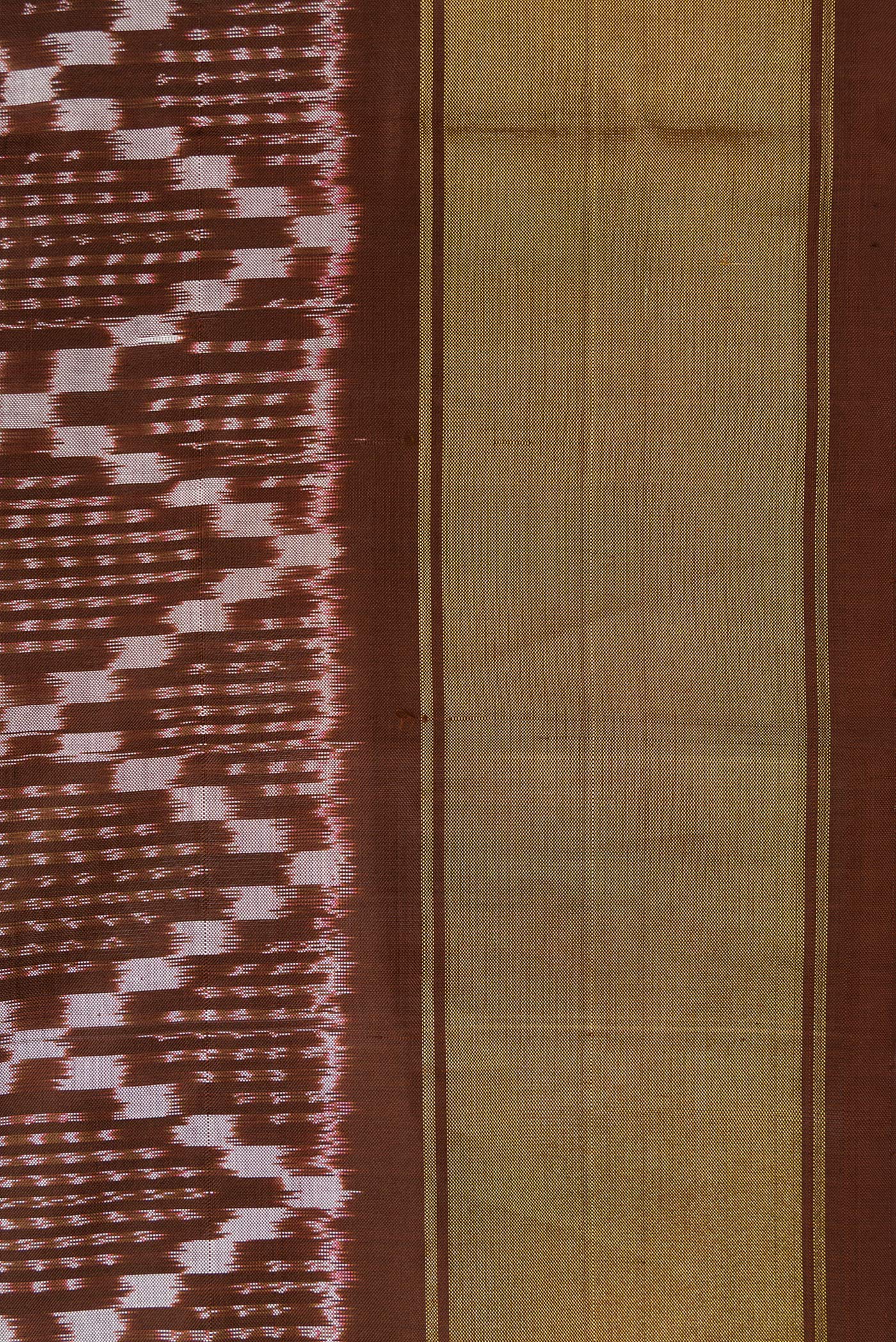 Border image of Brown Dual Tone Double Ikat Saree with Ikat Print on the body and Zari Border. 