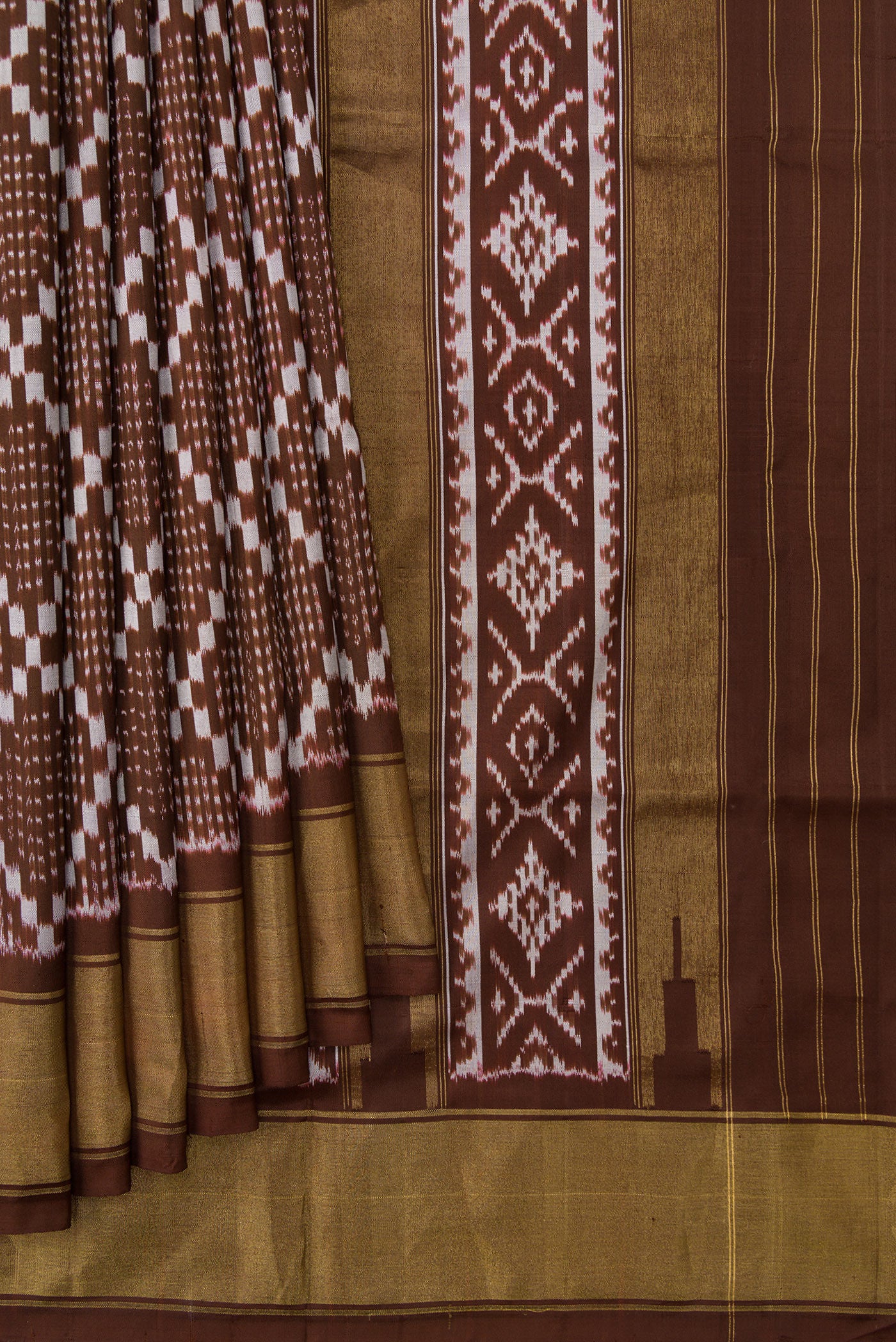 Pleats and pallu of Brown Dual Tone Double Ikat Saree with Ikat Print on the body and Zari Border. 