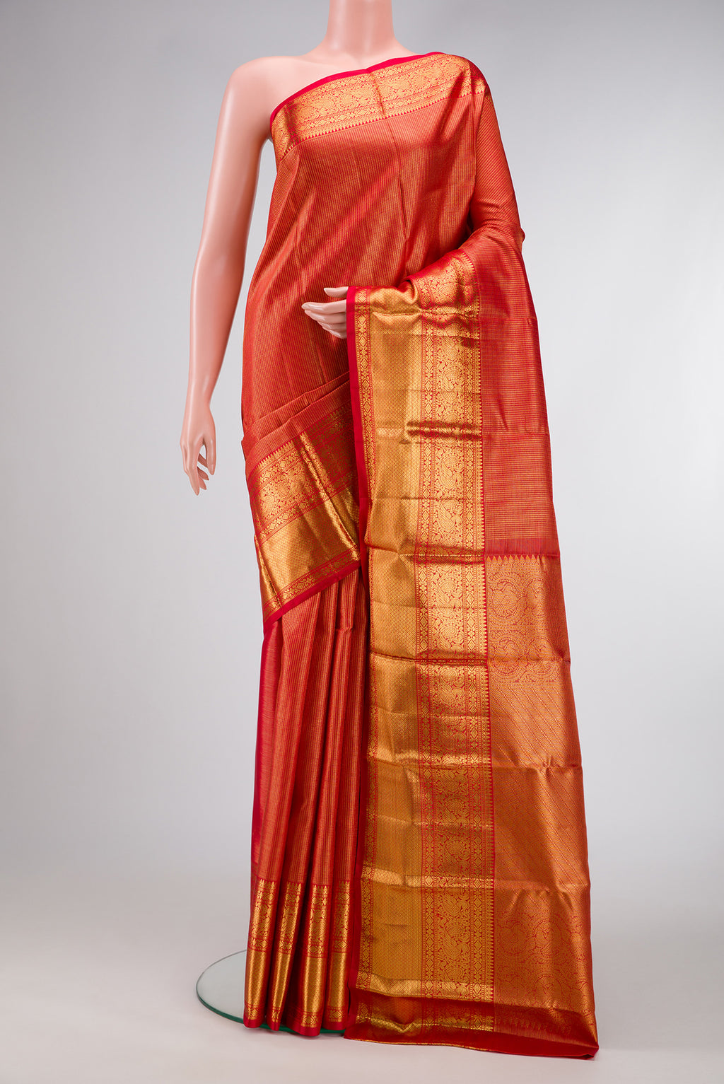 Red Dual Tone Kanchipuram Silk Saree with Zari Brocade on the body and Zari Border.  displayed on a mannequin