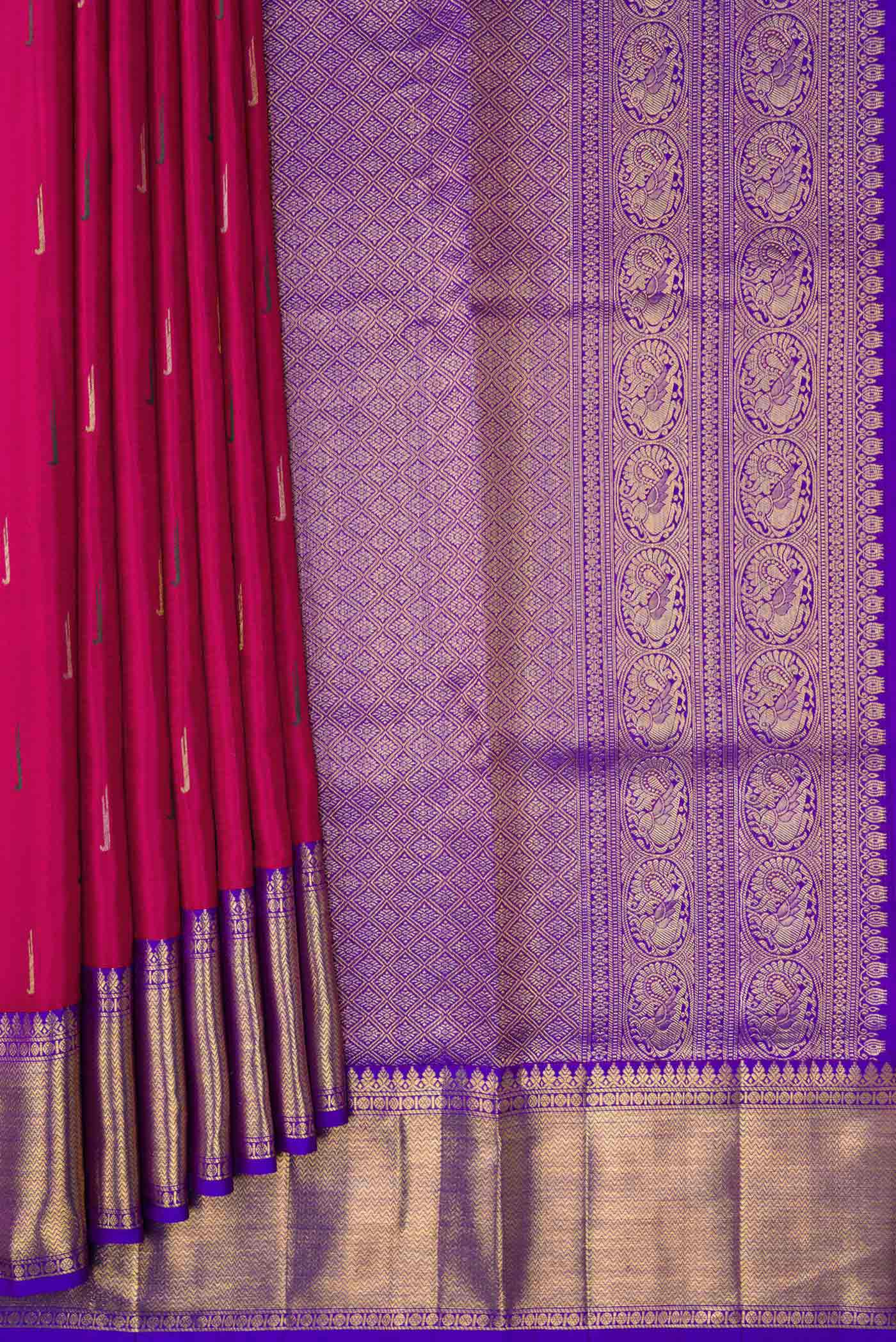 Pleats and pallu of Magenta Dual Tone Kanchipuram Silk Saree with Zari And Thread Butta on the body and Zari Border. 