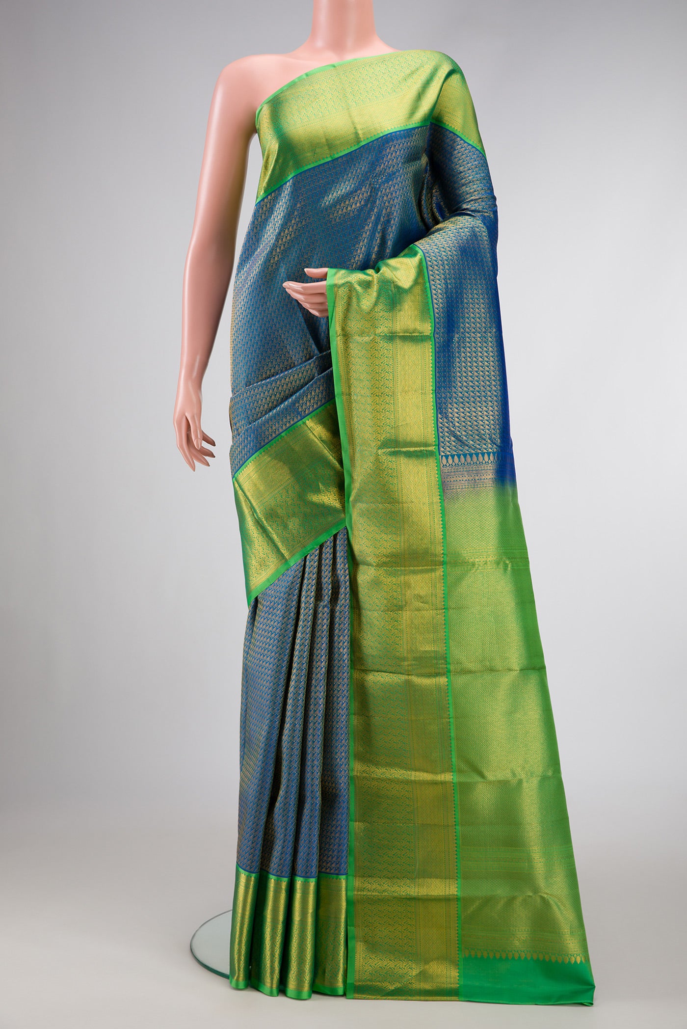 Peacock Blue Dual Tone Kanchipuram Silk Saree with Zari Brocade on the body and Zari Border.  displayed on a mannequin